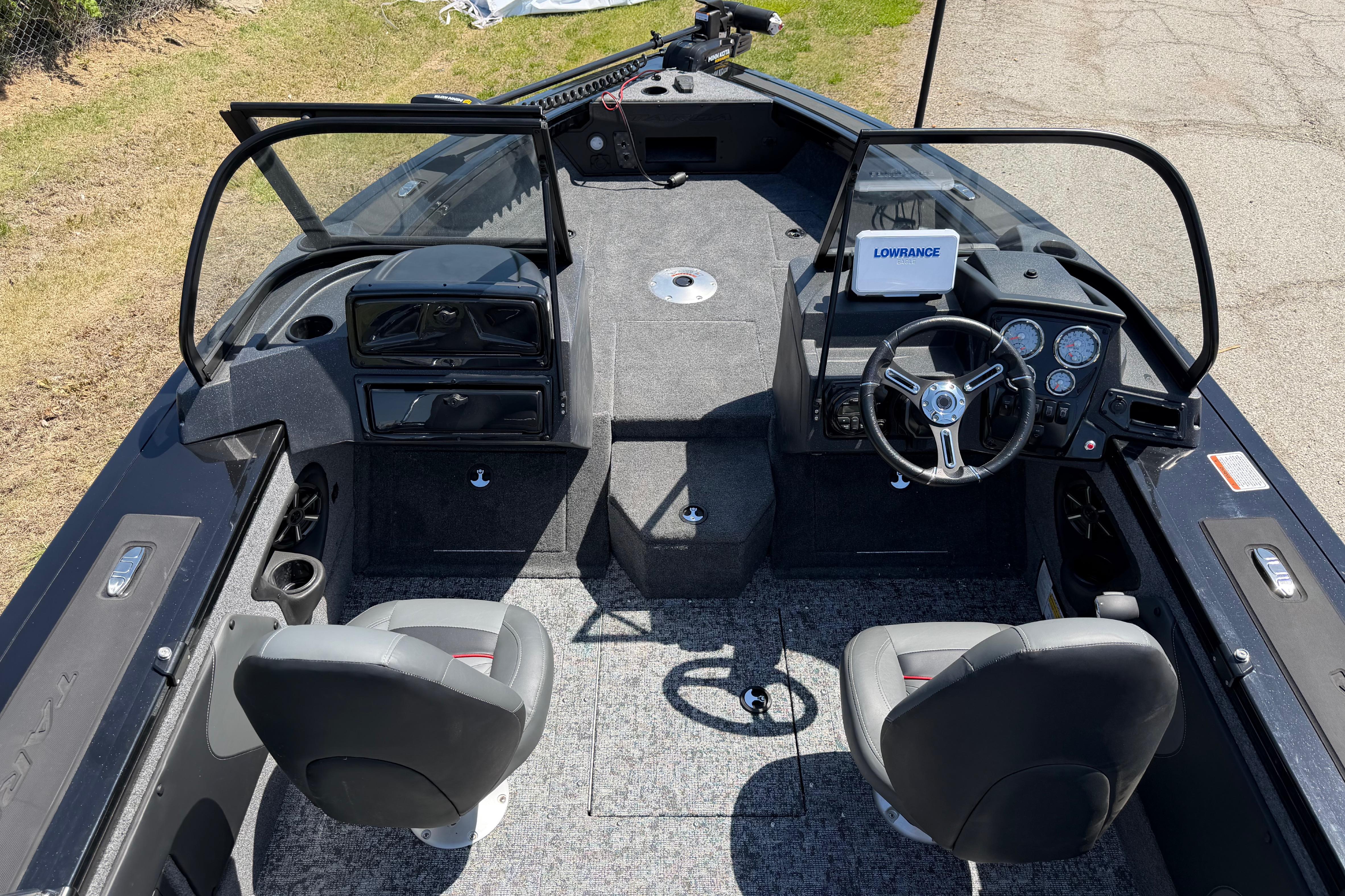 2026 Tracker Targa V-19 WT boat interior with steering wheel and seating.