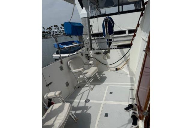 1982 Lancer 45 Motorsailer deck with chairs and nautical equipment.