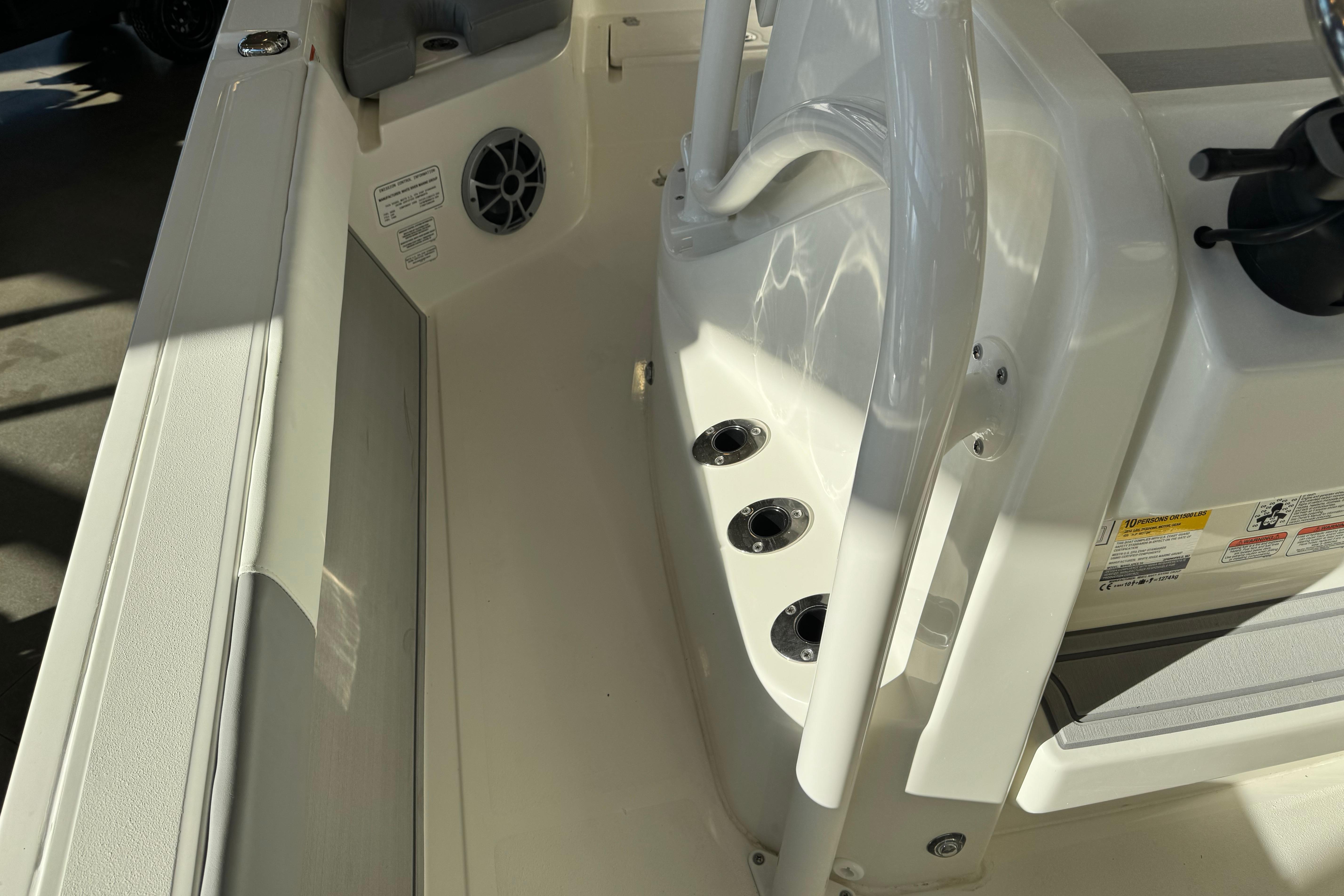 2026 Mako 24 APEX boat interior, featuring seating and control panel details.