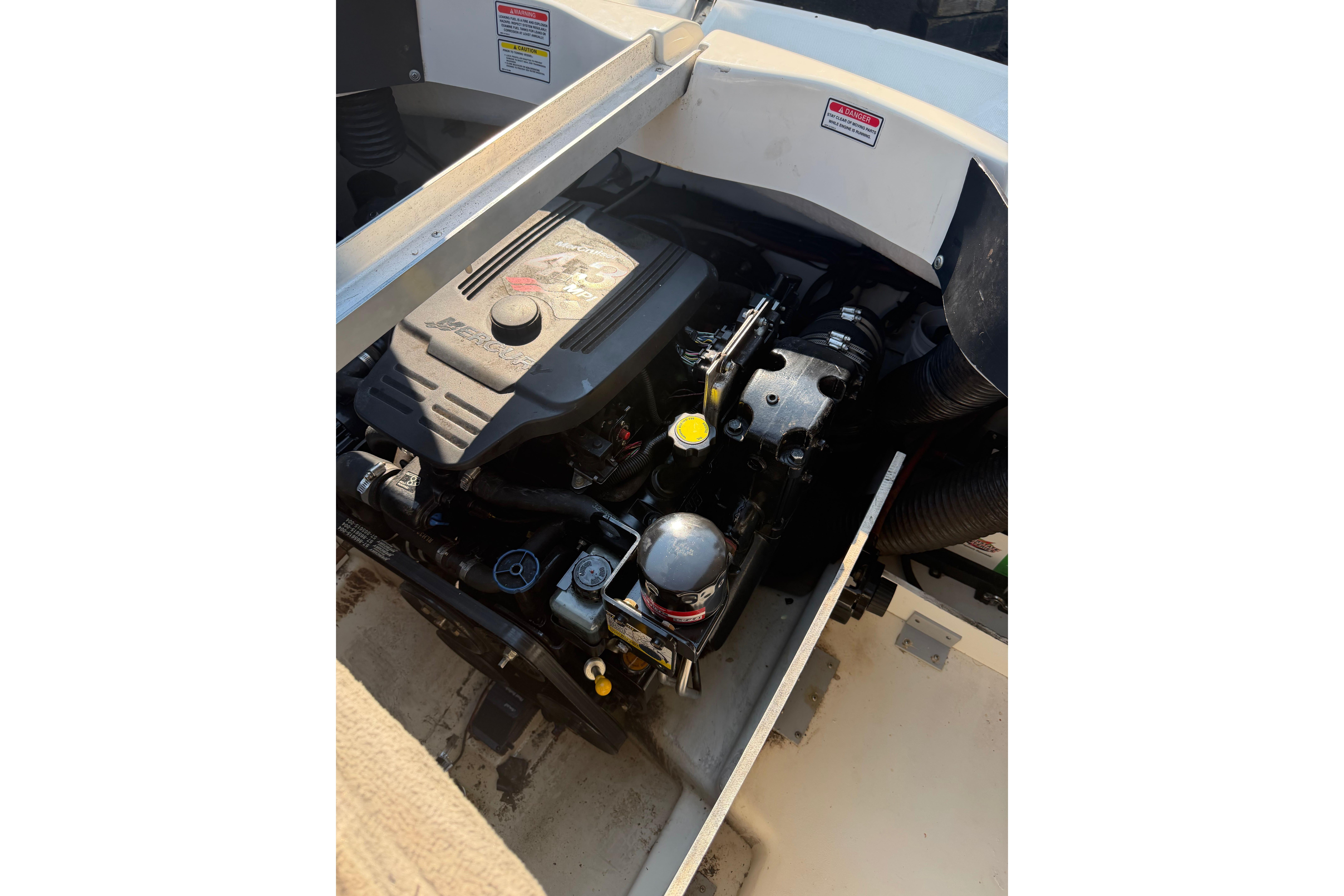 Engine compartment of a 2006 Sea Ray 195 Sport boat, showcasing detailed components.