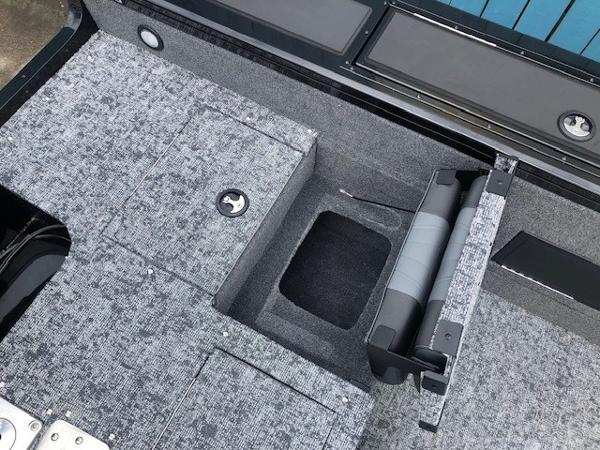 2025 Tracker Targa V18 Combo boat interior with storage compartments and seating.