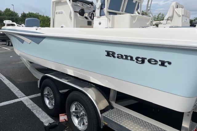 2025 Ranger 2360 Bay boat parked on trailer outdoors.
