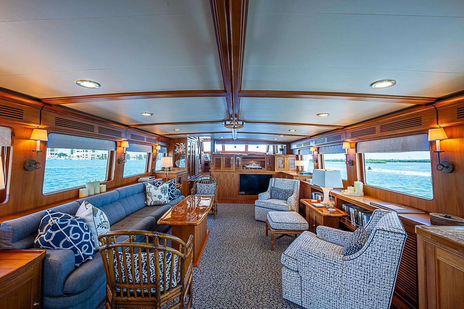 Luxurious interior of 2014 Marlow 80 Explorer yacht with elegant seating and ocean views.