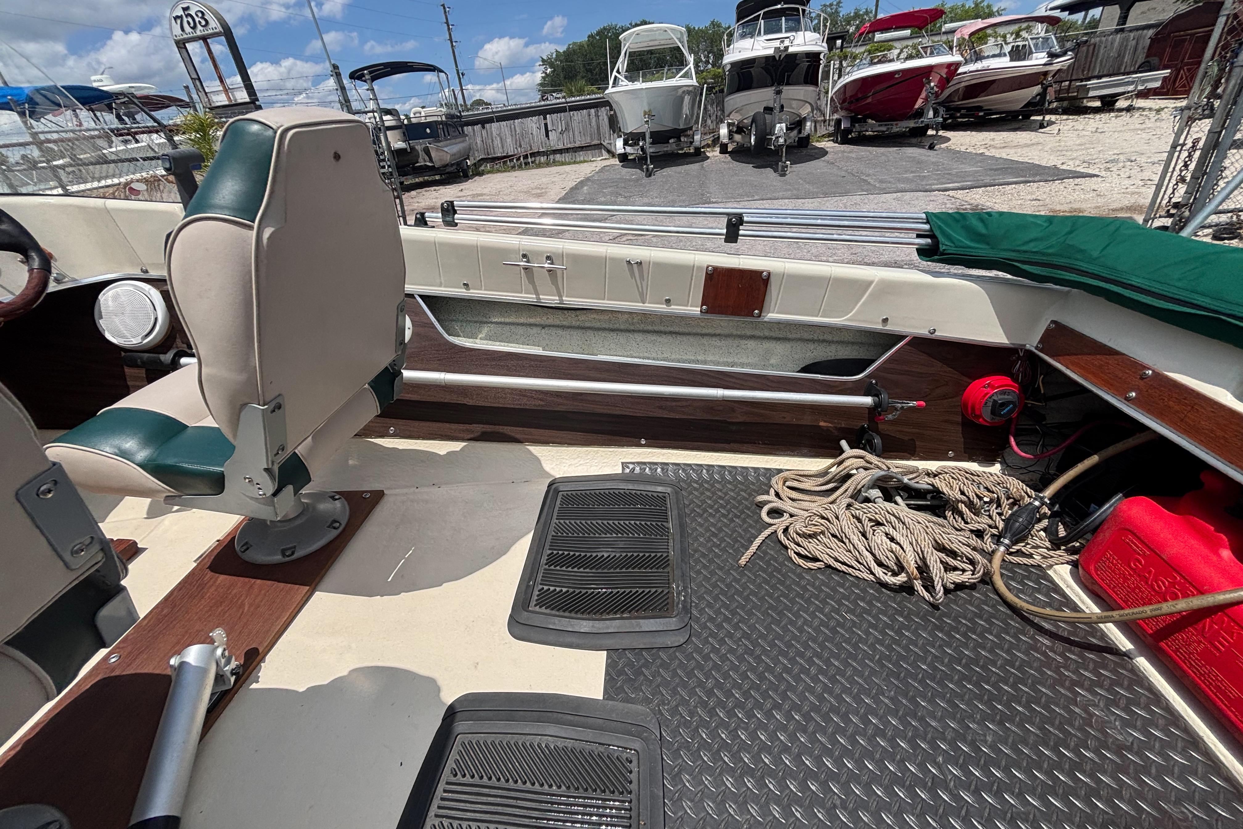 Interior of a 1966 Mohawk 15 boat with seating, ropes, and equipment.