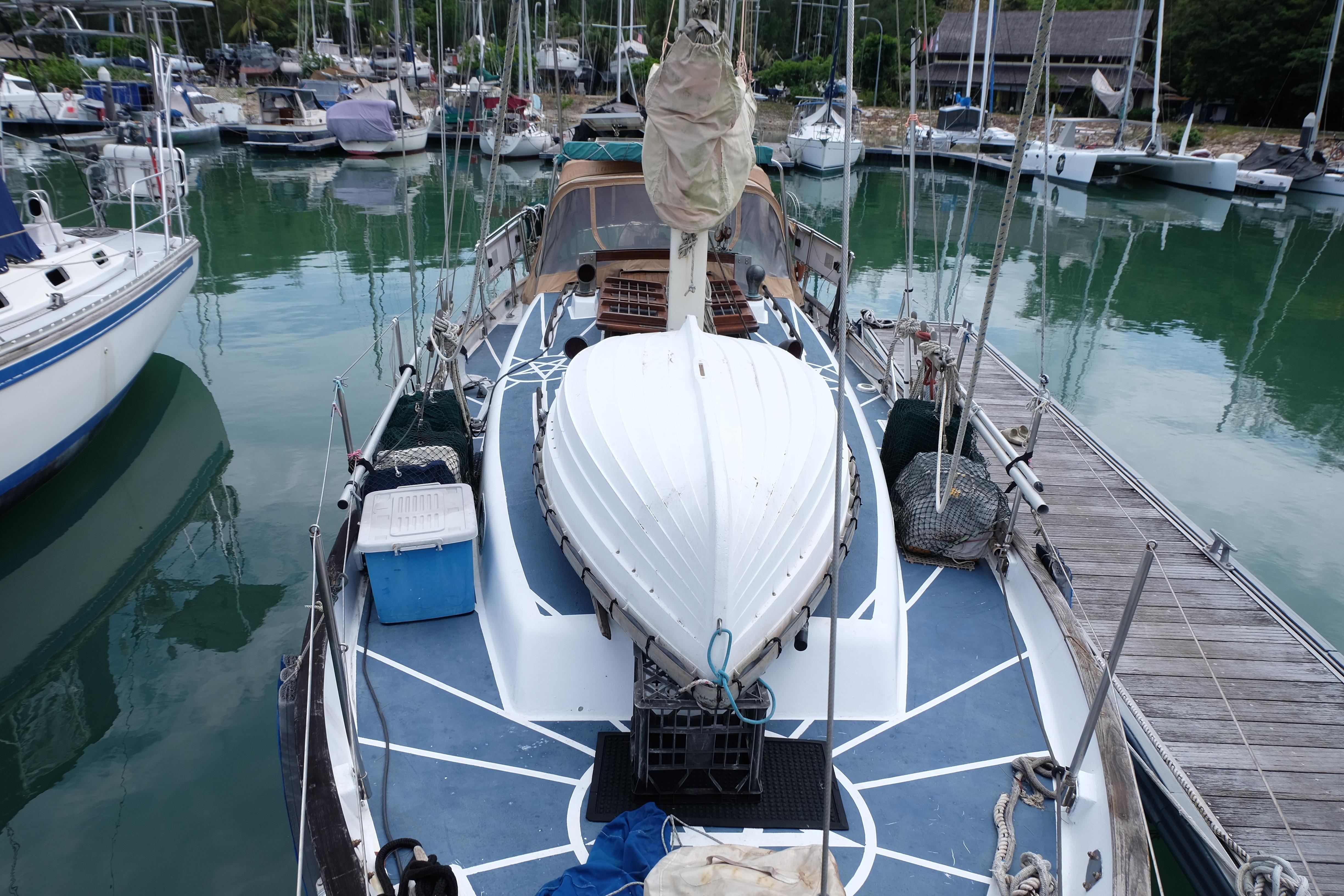 1979 Westwind 35 sailboat docked in a marina, surrounded by other boats.