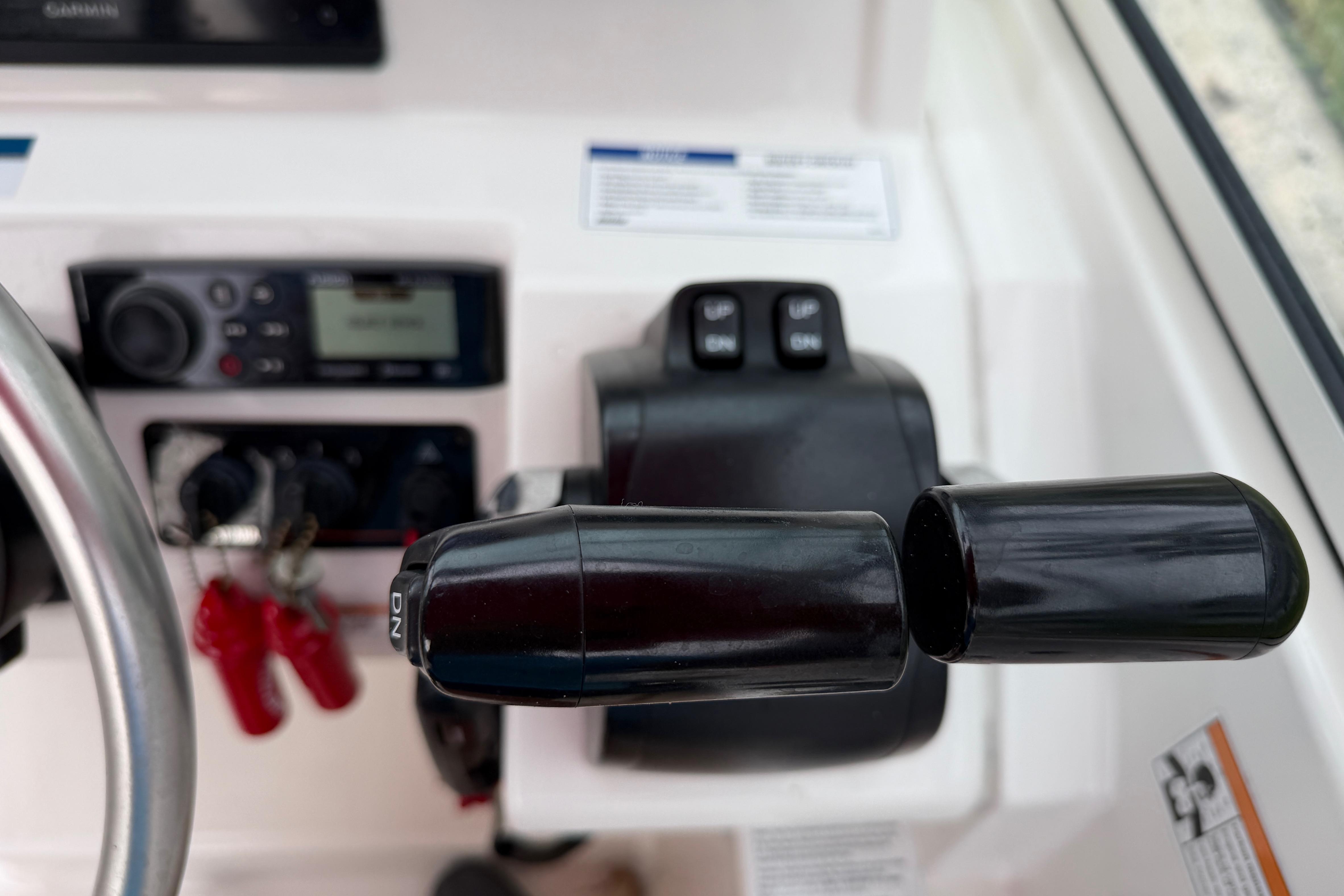 Close-up of 2019 World Cat 230 DC boat controls and dashboard.