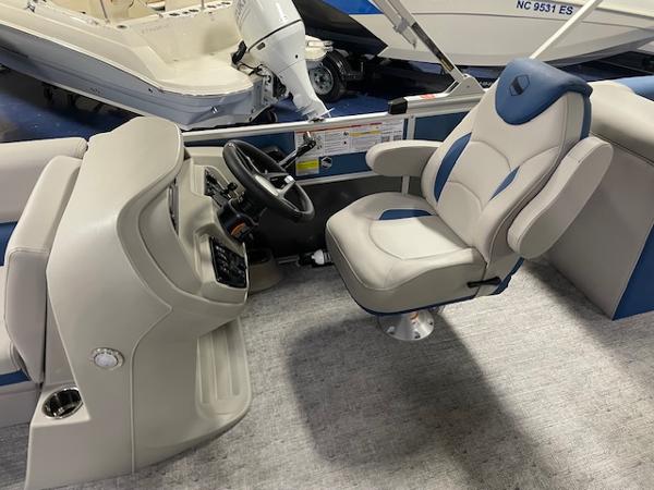 2025 South Bay LE boat interior with captain's chair and steering console.