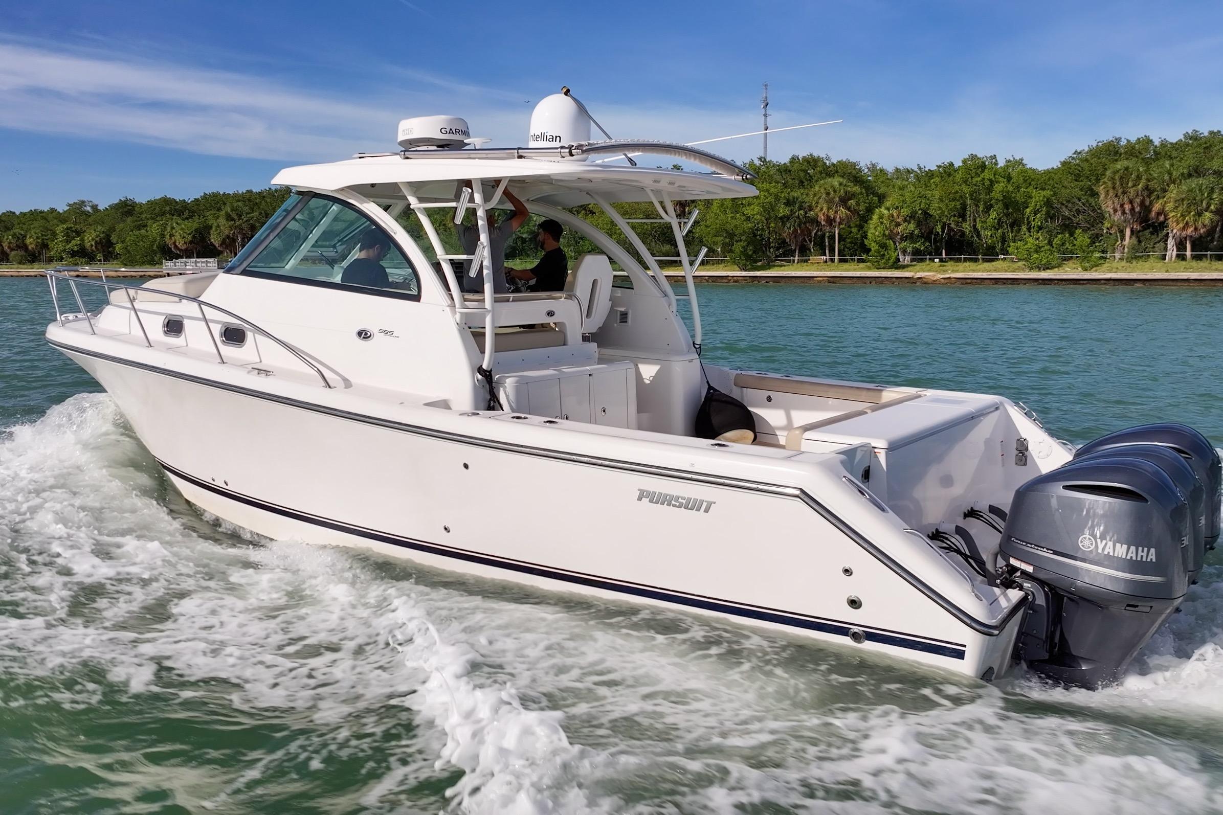2016 Pursuit OS 385 Offshore boat cruising on a sunny day with Yamaha engines.