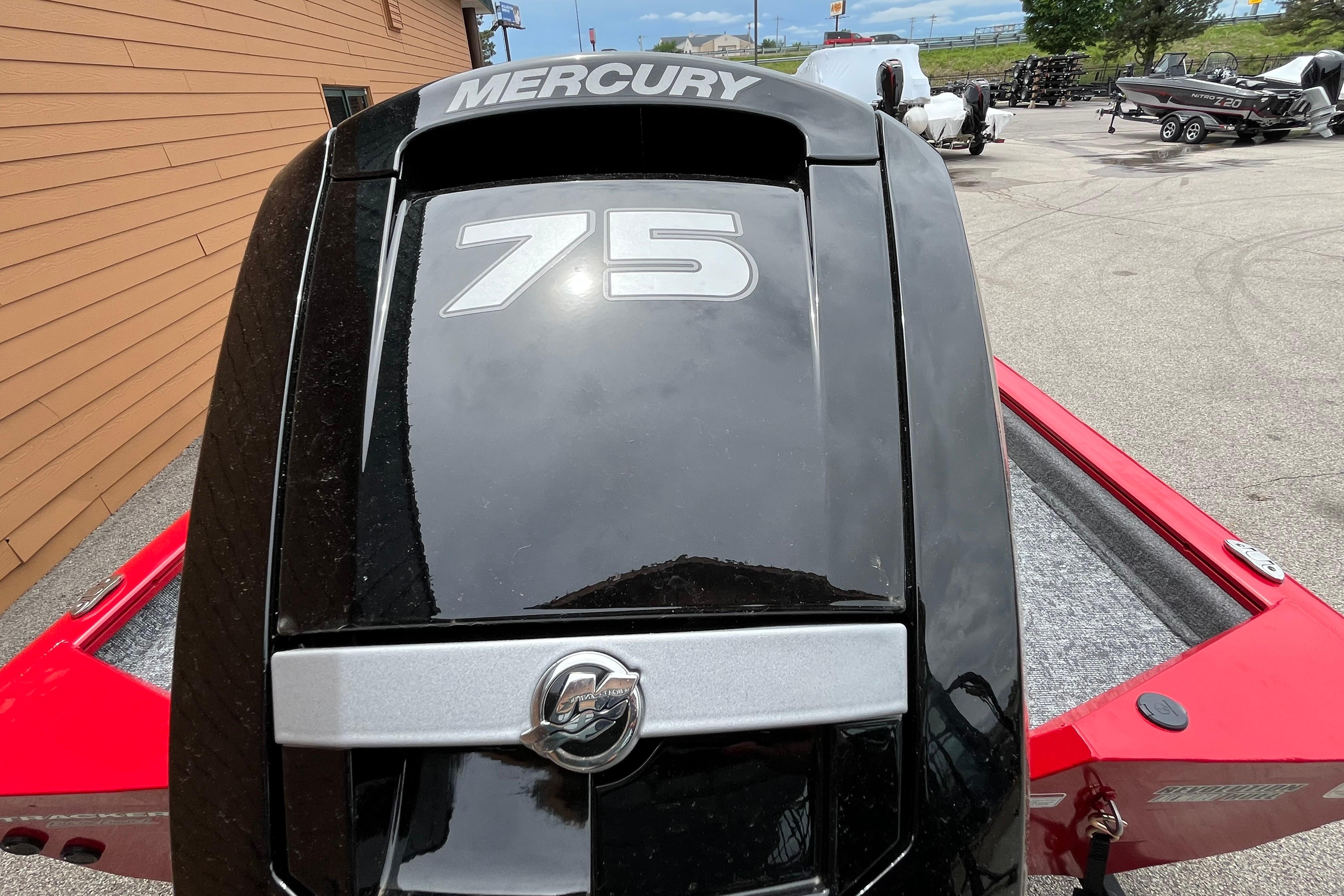 Mercury 75 engine on 2026 Tracker Pro Team 175 boat, parked outdoors.