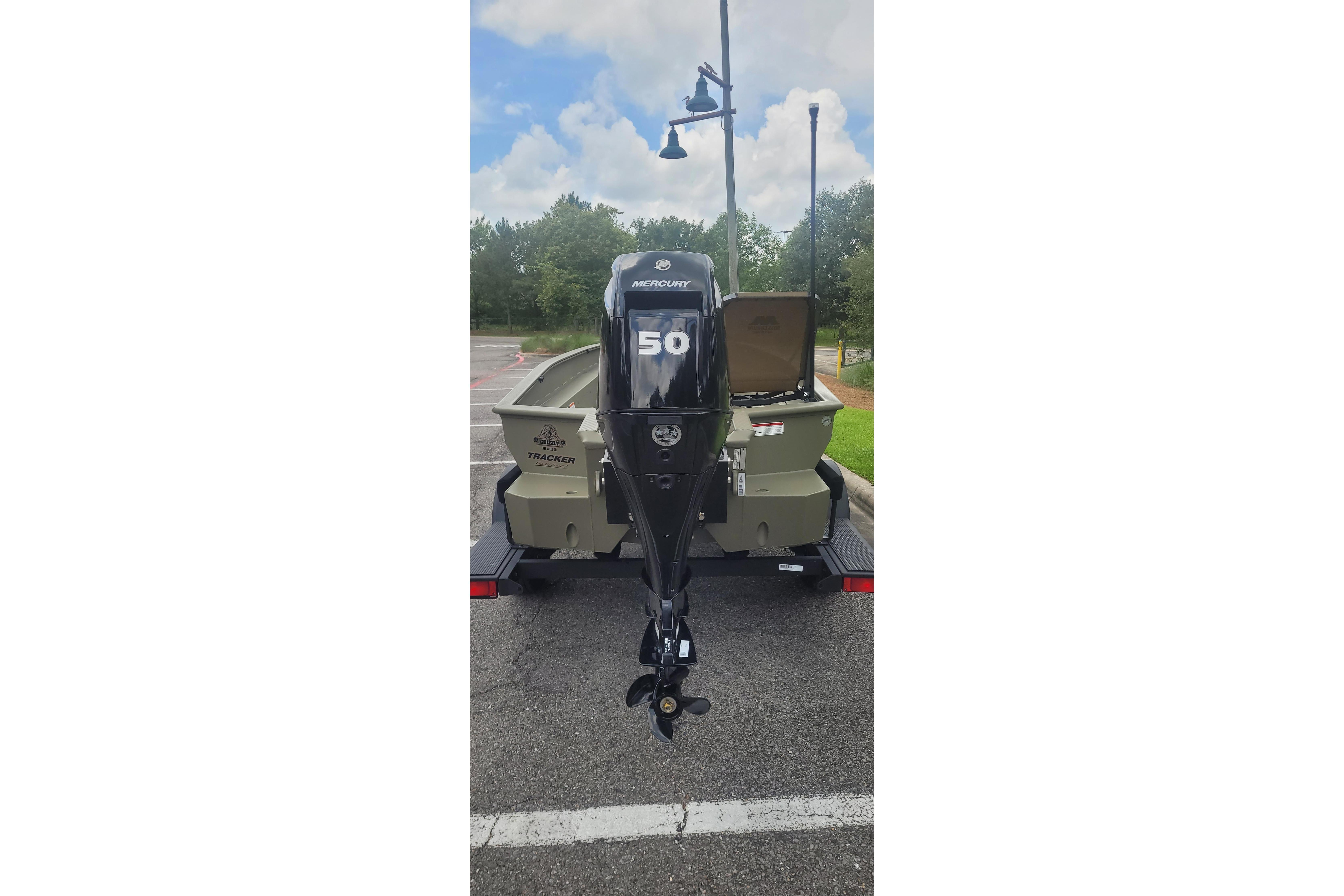 2026 Tracker Grizzly 1650 T Prairie Wings Edition boat with Mercury 50 outboard motor.