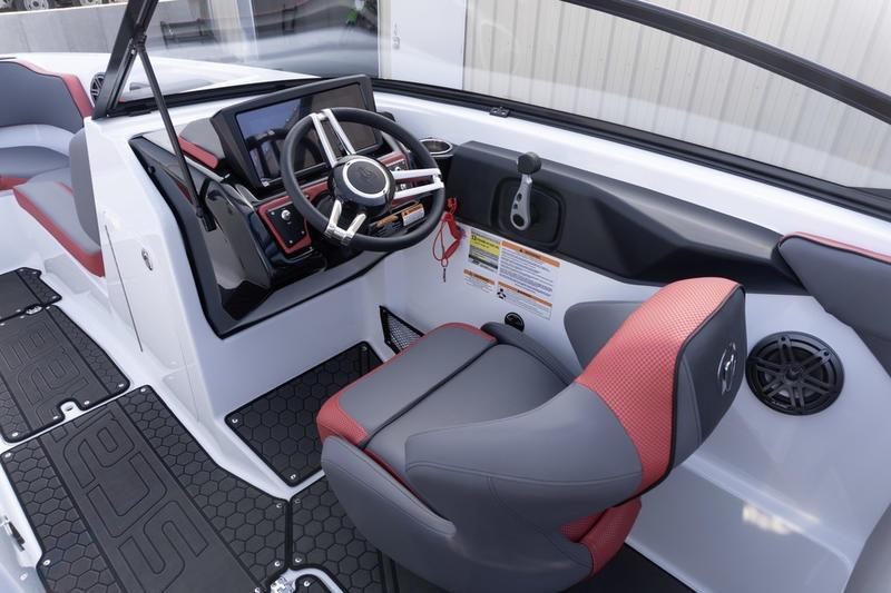 2026 Scarab 255 LX Wake boat interior with modern helm and red-accented seating.