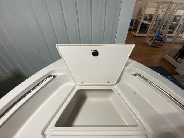 2024 Key West 189 FS boat storage compartment with open lid.