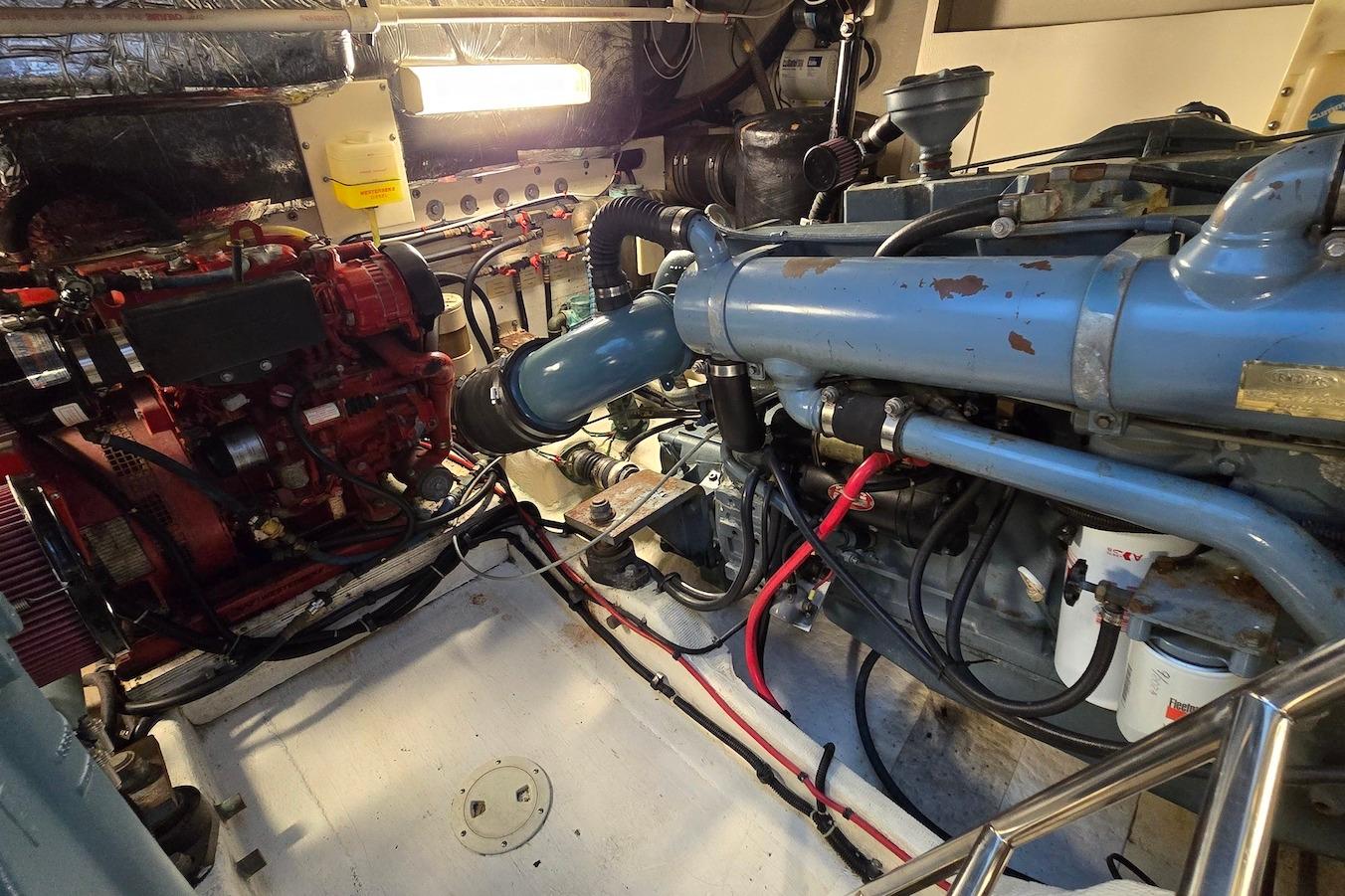Engine room of a 1996 Tiara Yachts 3700 Open, showcasing mechanical components.