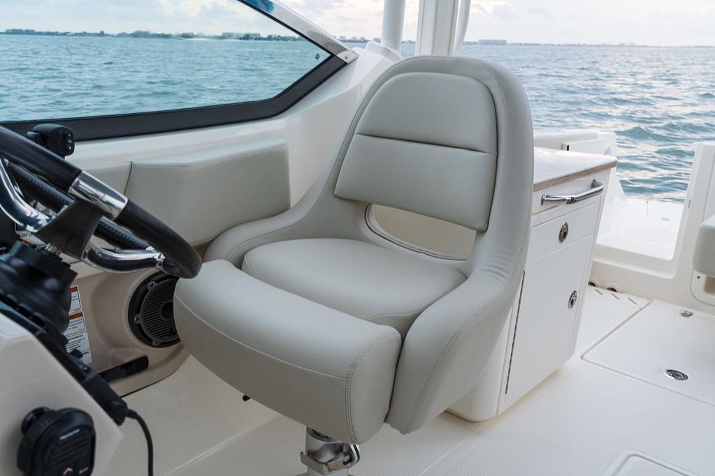 2026 Boston Whaler 240 Vantage boat interior with luxurious seating and steering wheel.