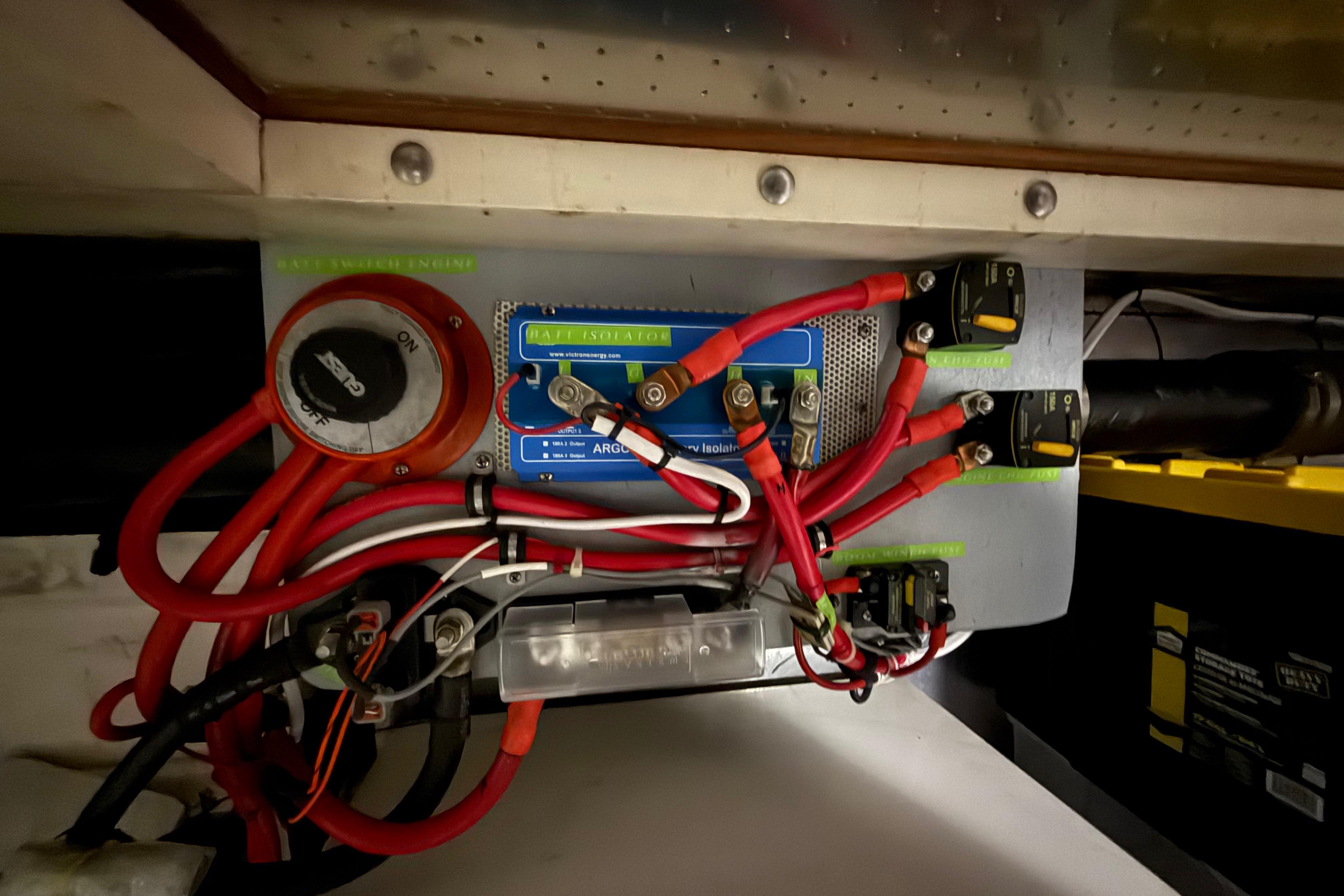 Electrical system of a 2001 Kadey-Krogen 39 boat, featuring wiring and battery isolator.