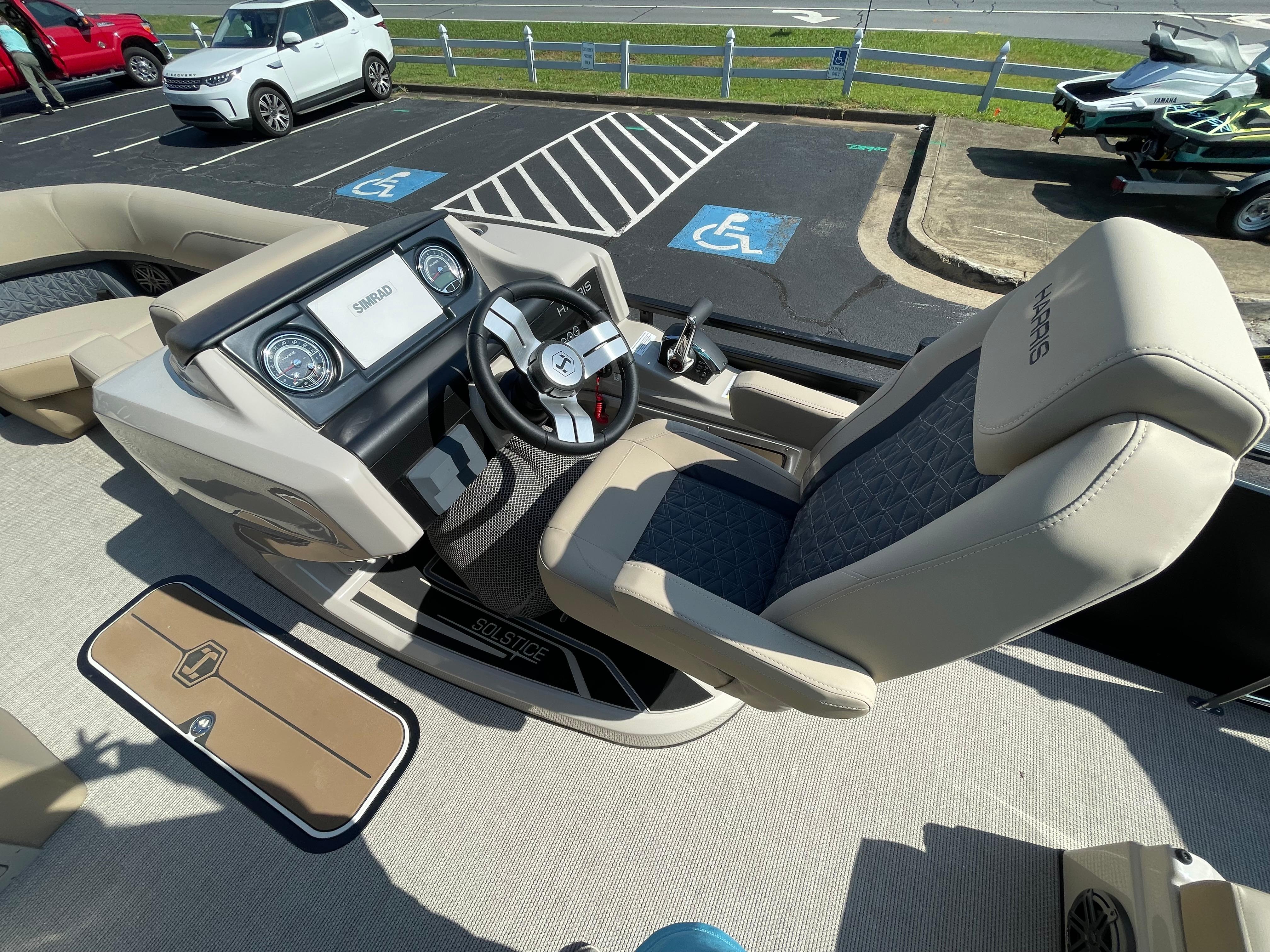 2026 Harris Solstice 230 boat interior with modern dashboard and comfortable seating.