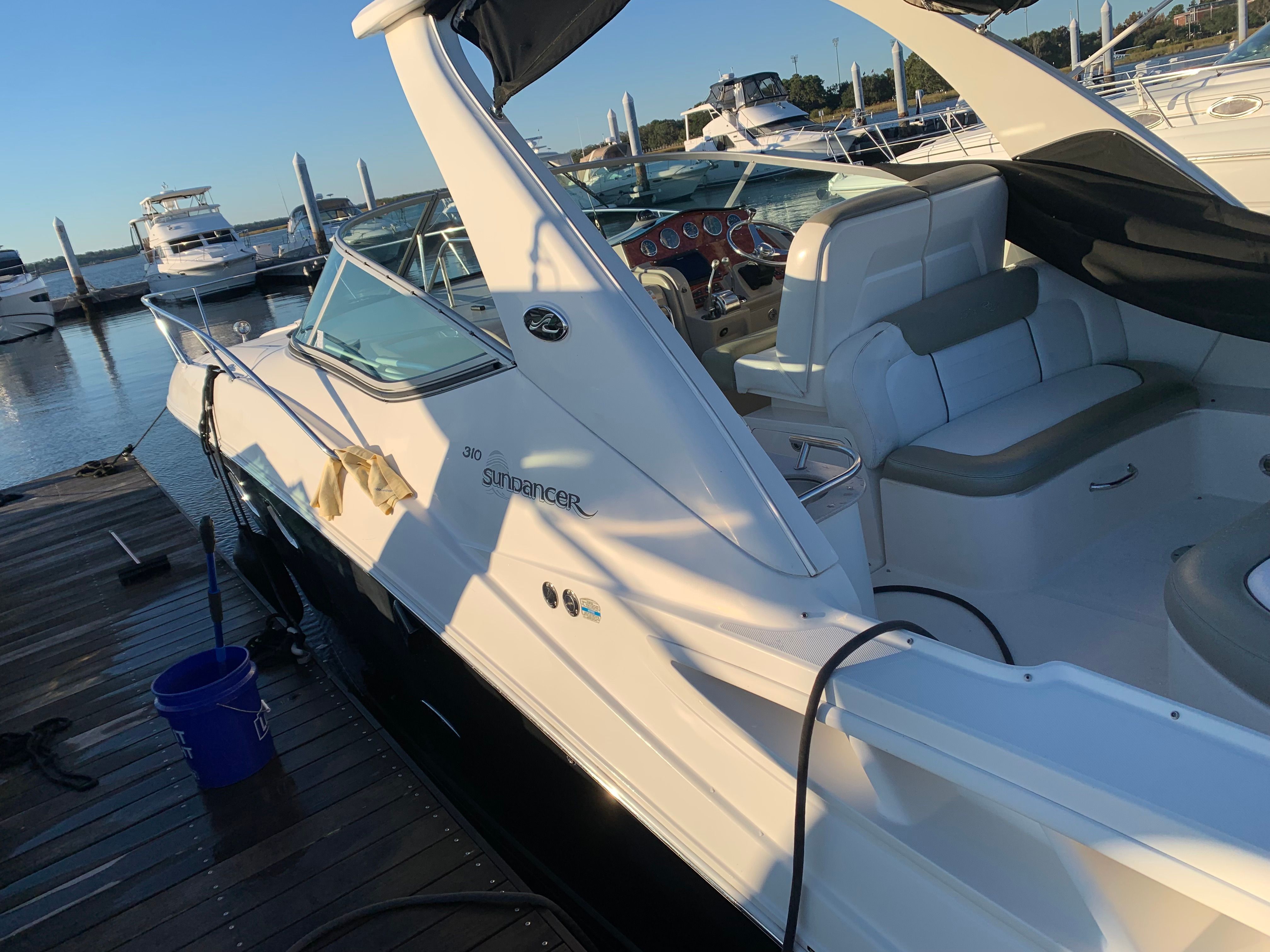 2007 Sea Ray Sundancer 310 docked at sunset.