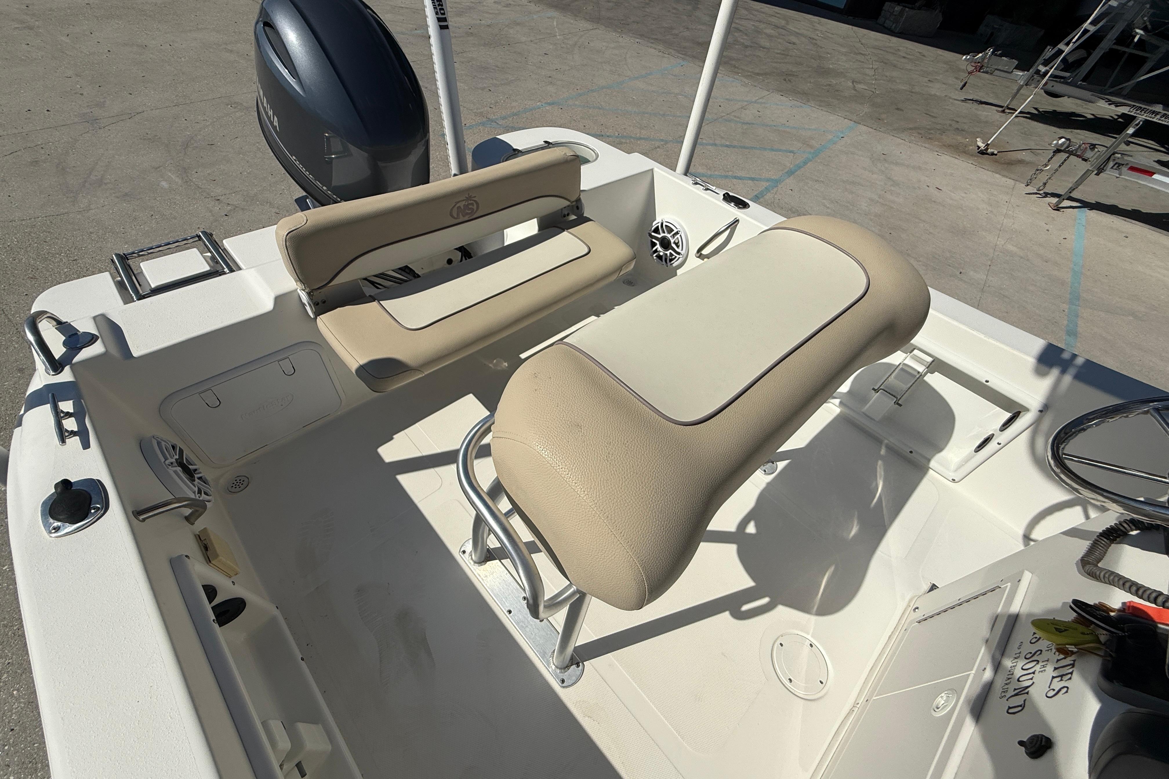 2019 NauticStar 19 XS boat interior with seating and Yamaha outboard motor.