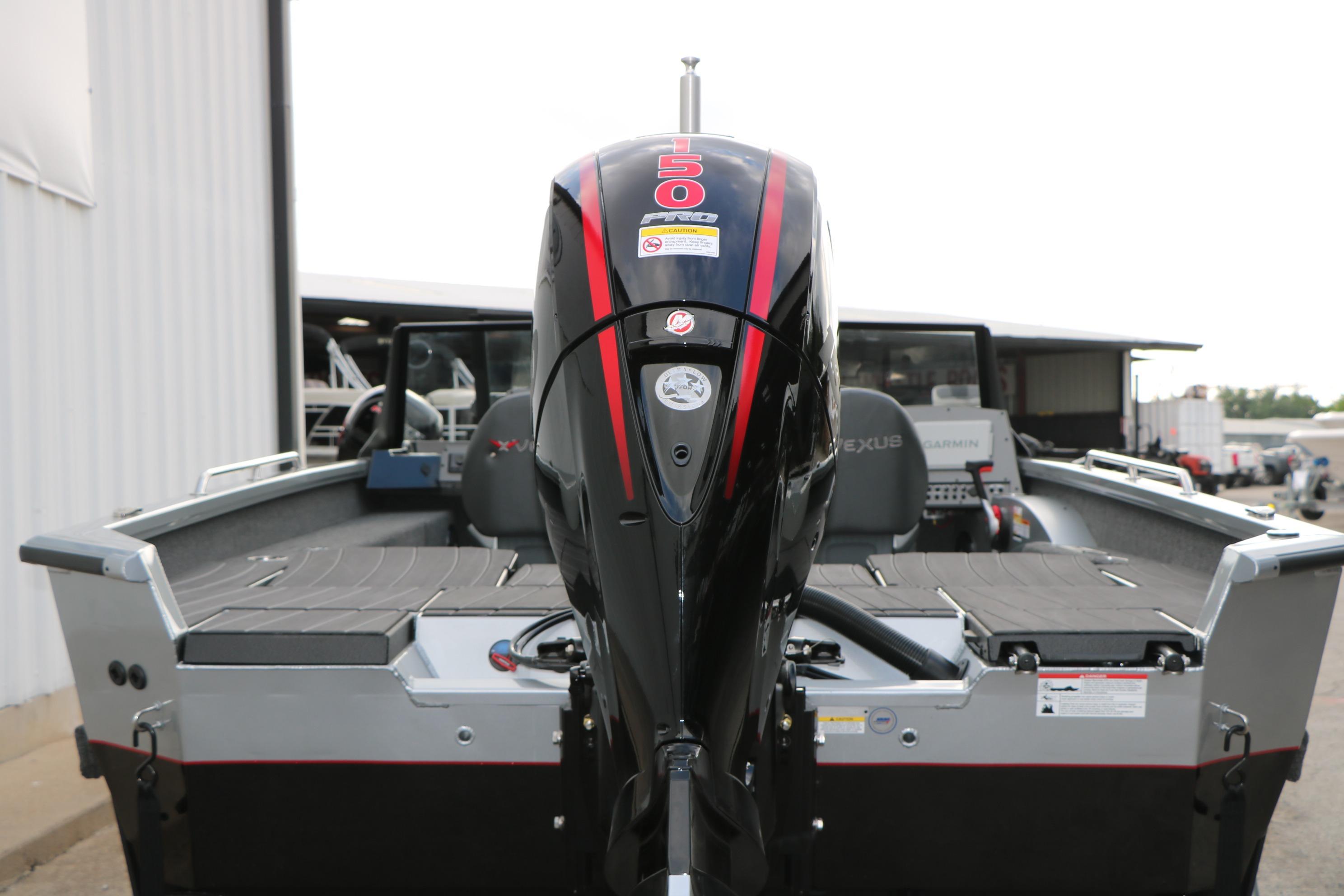 2026 Vexus ADX 190 boat with powerful outboard motor, rear view.