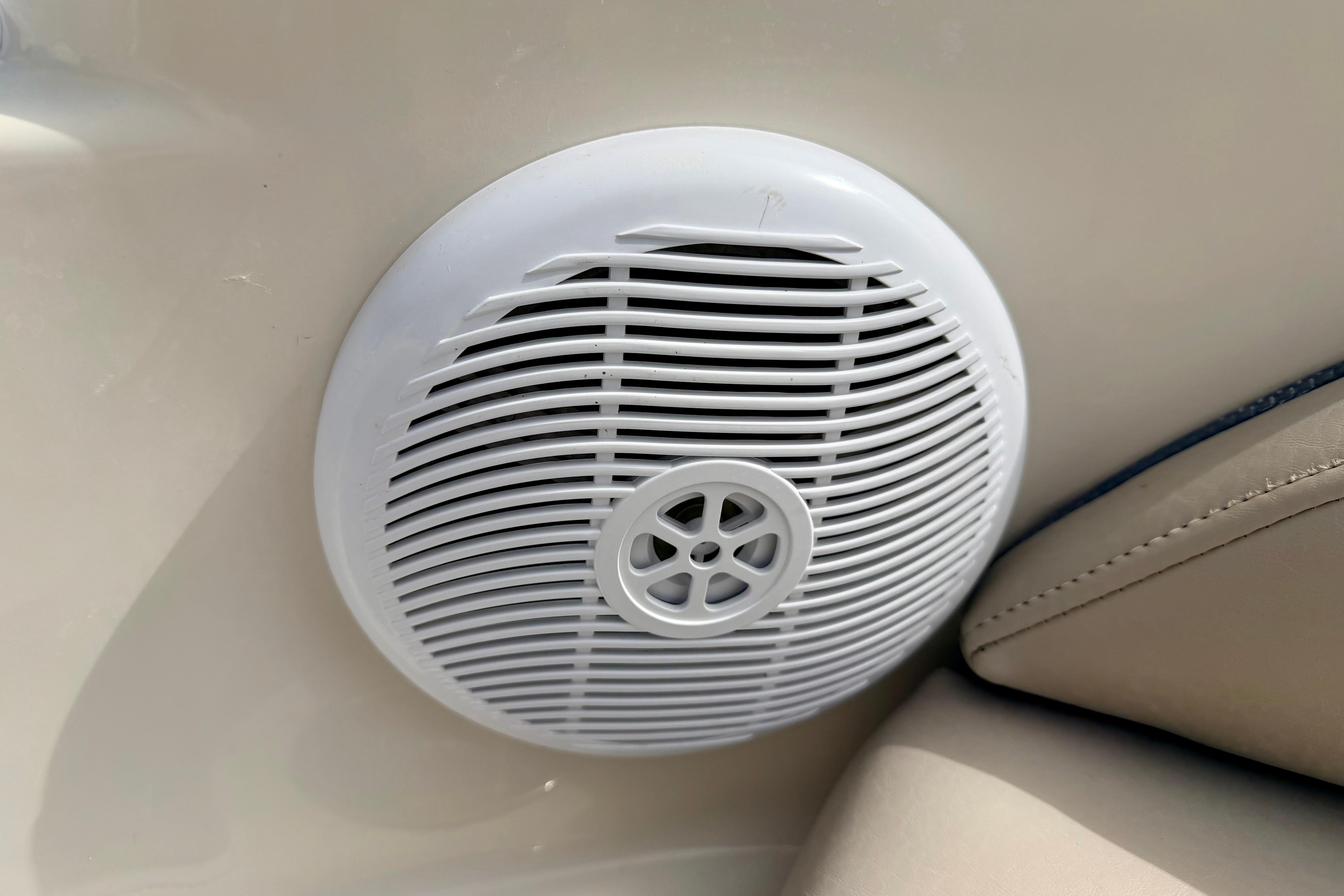 White speaker on 2003 Sea Ray 200 Sundeck boat interior.