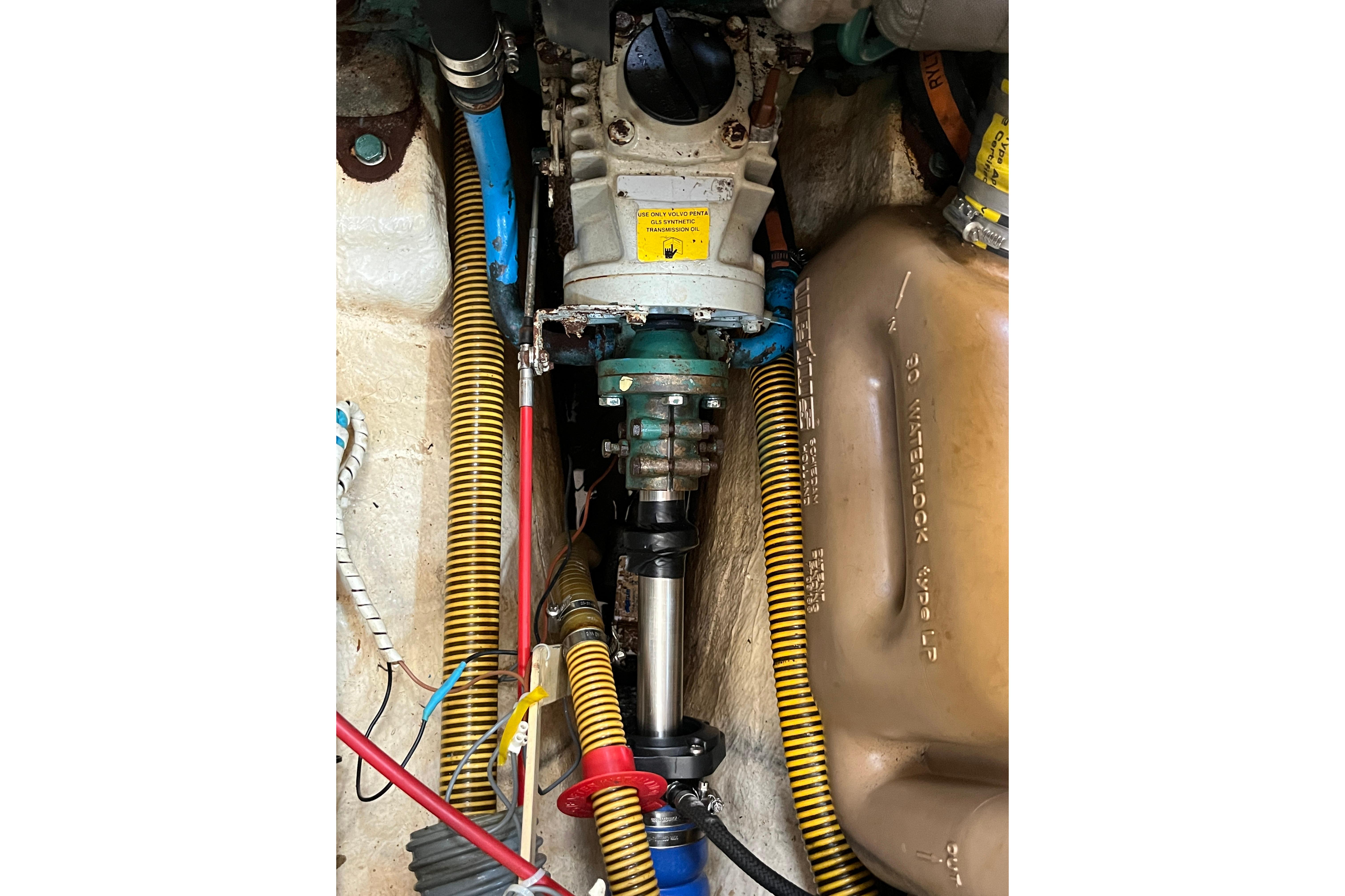 Engine compartment of a 1995 Belliure 41 yacht, showcasing mechanical components and wiring.