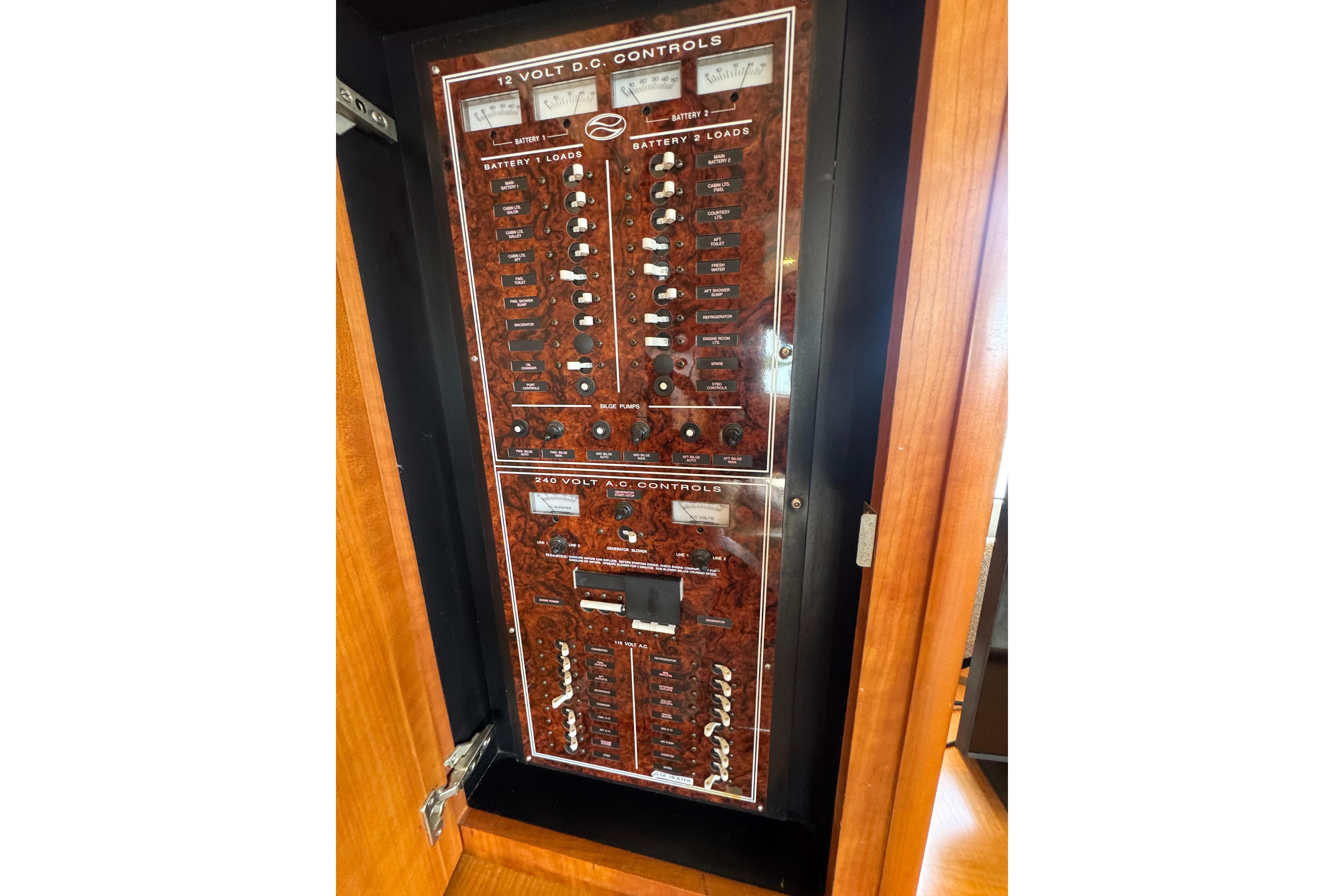 Electrical control panel on a 2003 Silverton 39 Motor Yacht, featuring 12V and 240V systems.
