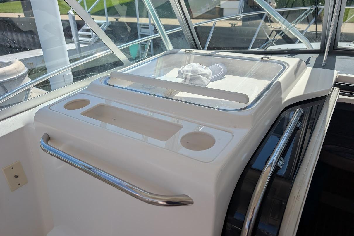 Interior view of a 2000 Pursuit 3400 Express boat with helm station details.