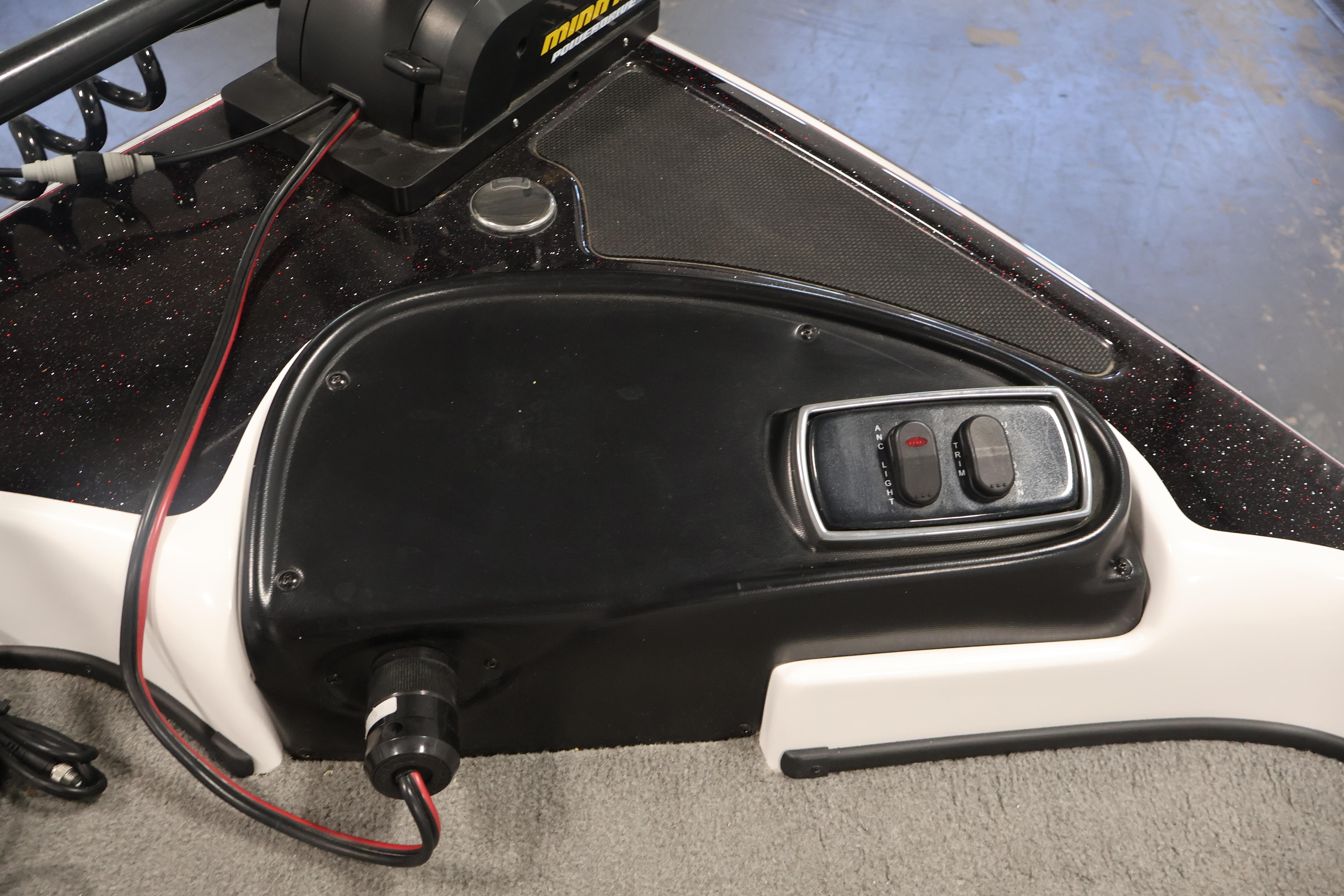 Control panel of a 2019 Nitro Z19 Sport boat with switches and wiring.