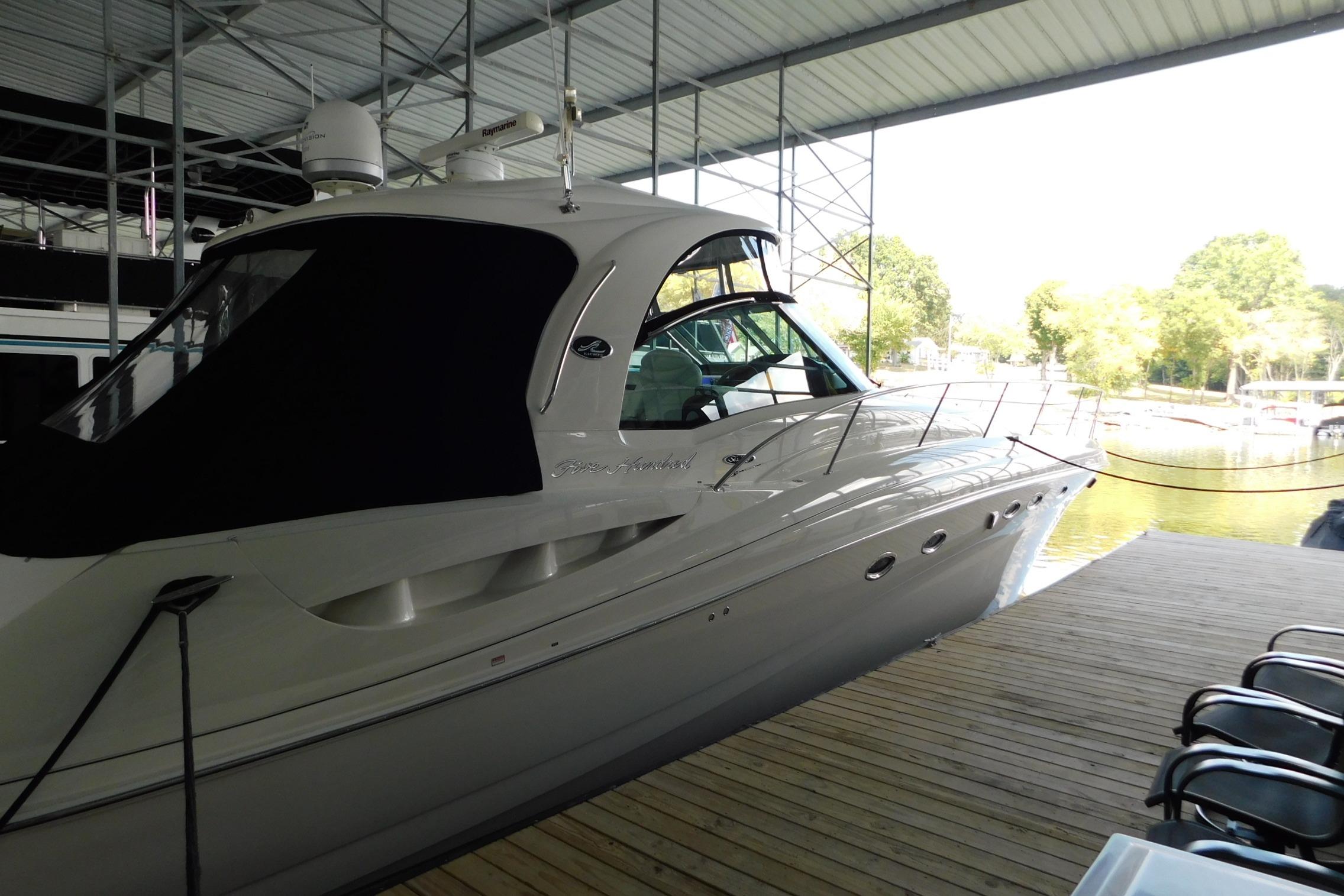 2004 Sea Ray 500 Sundancer yacht docked in a covered marina.