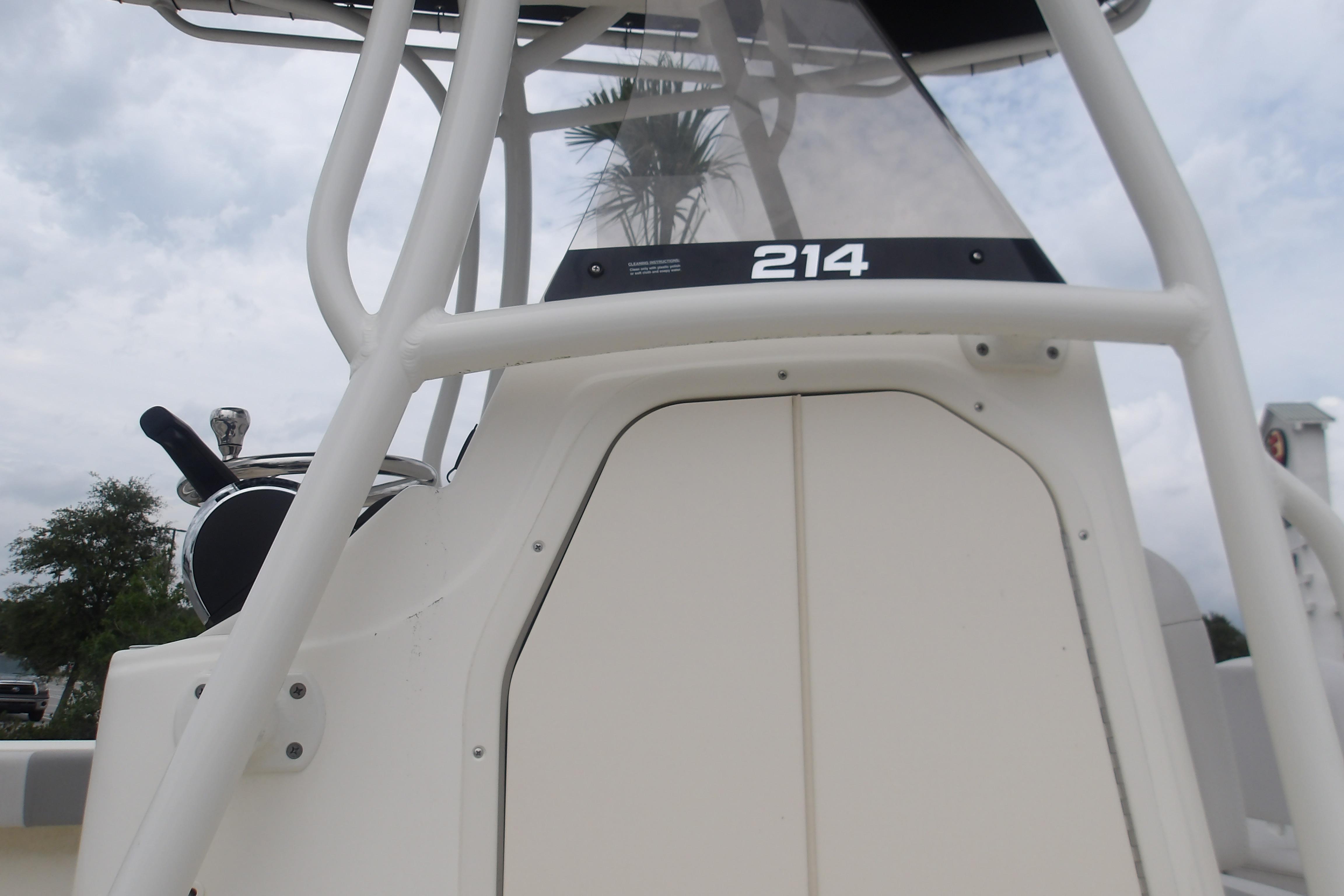 2025 Mako 214 Center Console boat, close-up of helm and console details.