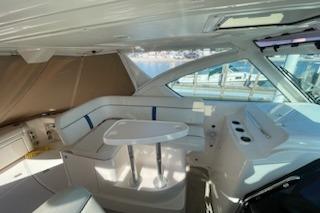 2013 Tiara Yachts 3100 Open interior with seating and table, featuring modern design.