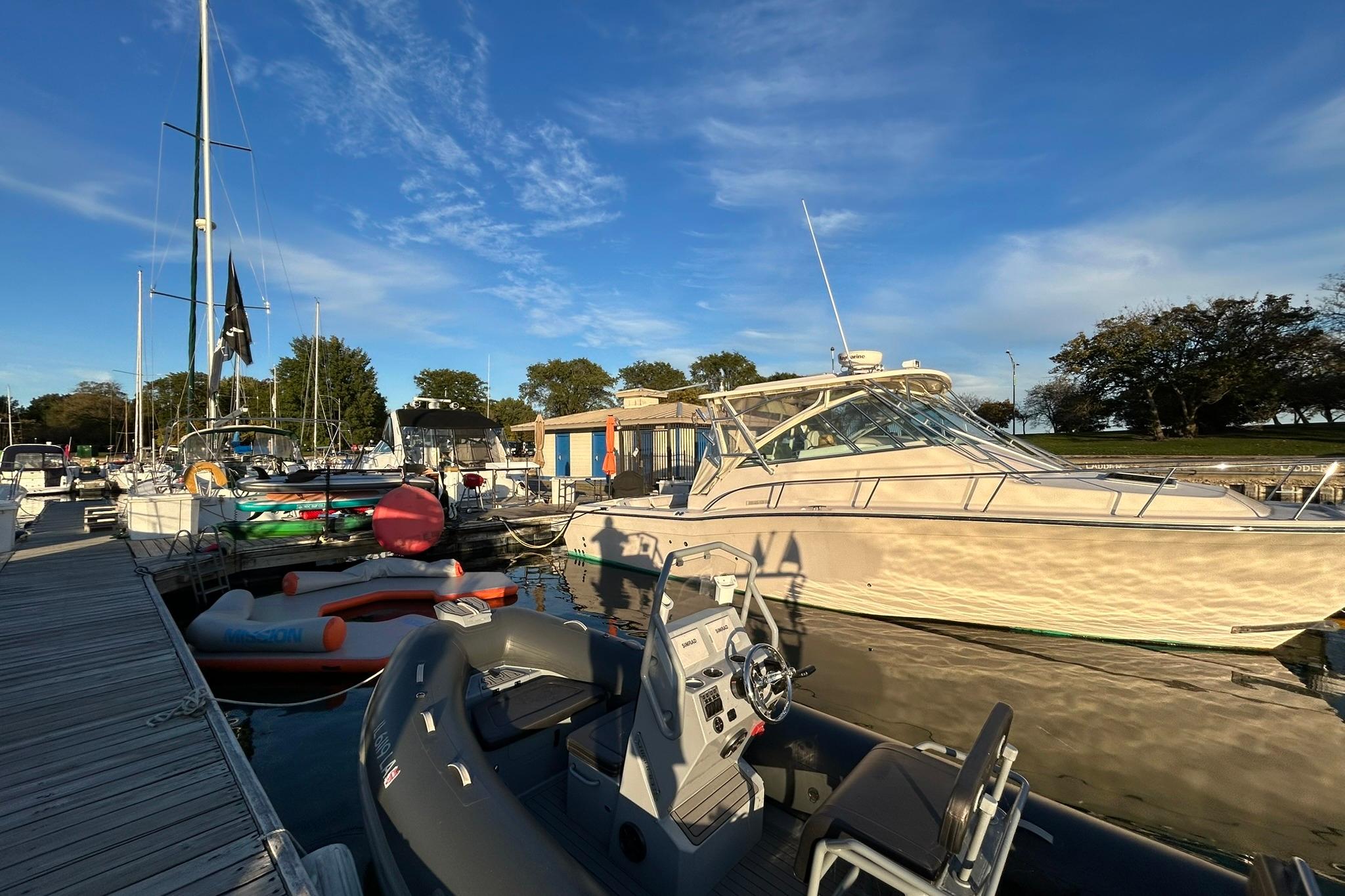 2007 Grady-White Express 360 docked at marina under clear blue sky.