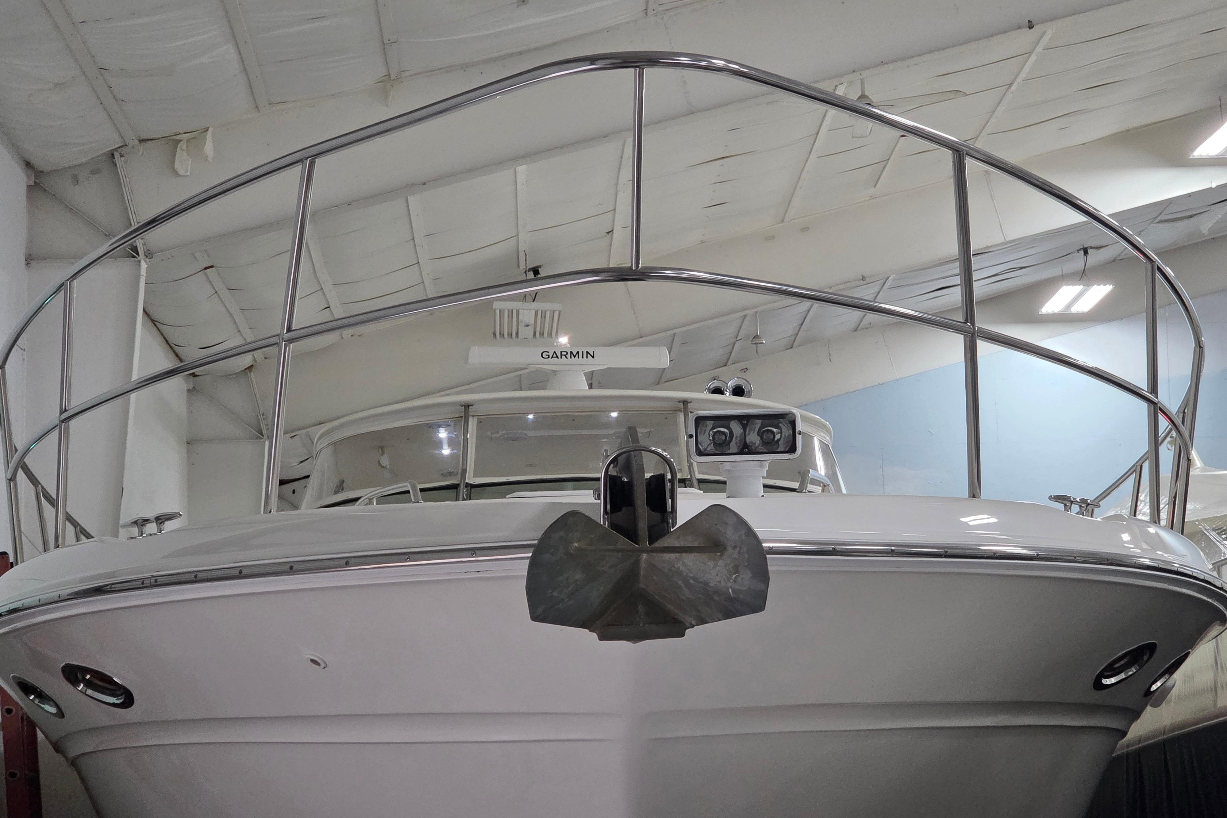 Front view of a 2000 Sea Ray Sundancer 540 yacht in a storage facility.