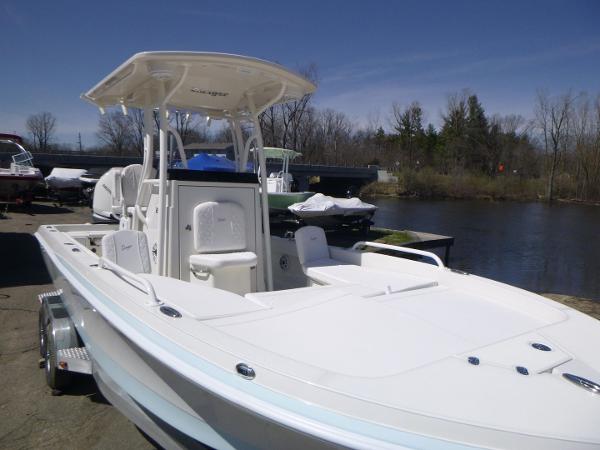 2024 Ranger 2360 Bay boat docked by a serene river.
