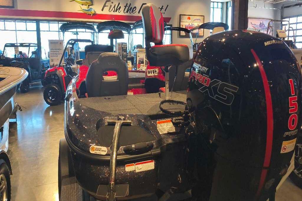 2026 Nitro Z18 Pro boat with Mercury 150 Pro XS engine in showroom.