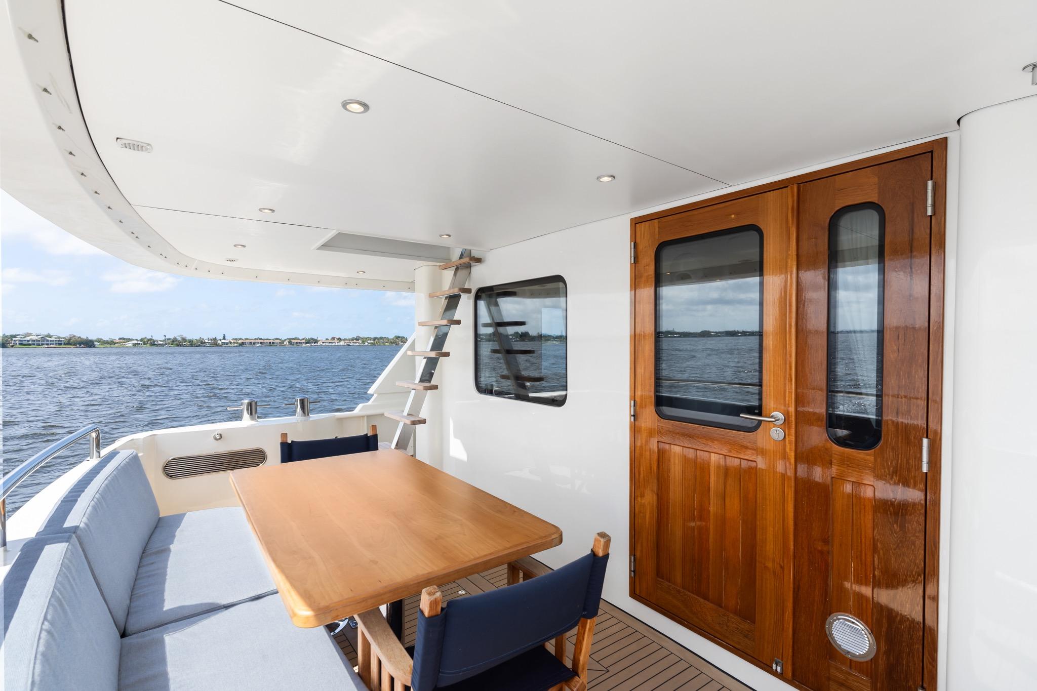 Outdoor seating area on 2022 Alm Trawler Delfino 64 yacht by Jachtbouw De Alm.