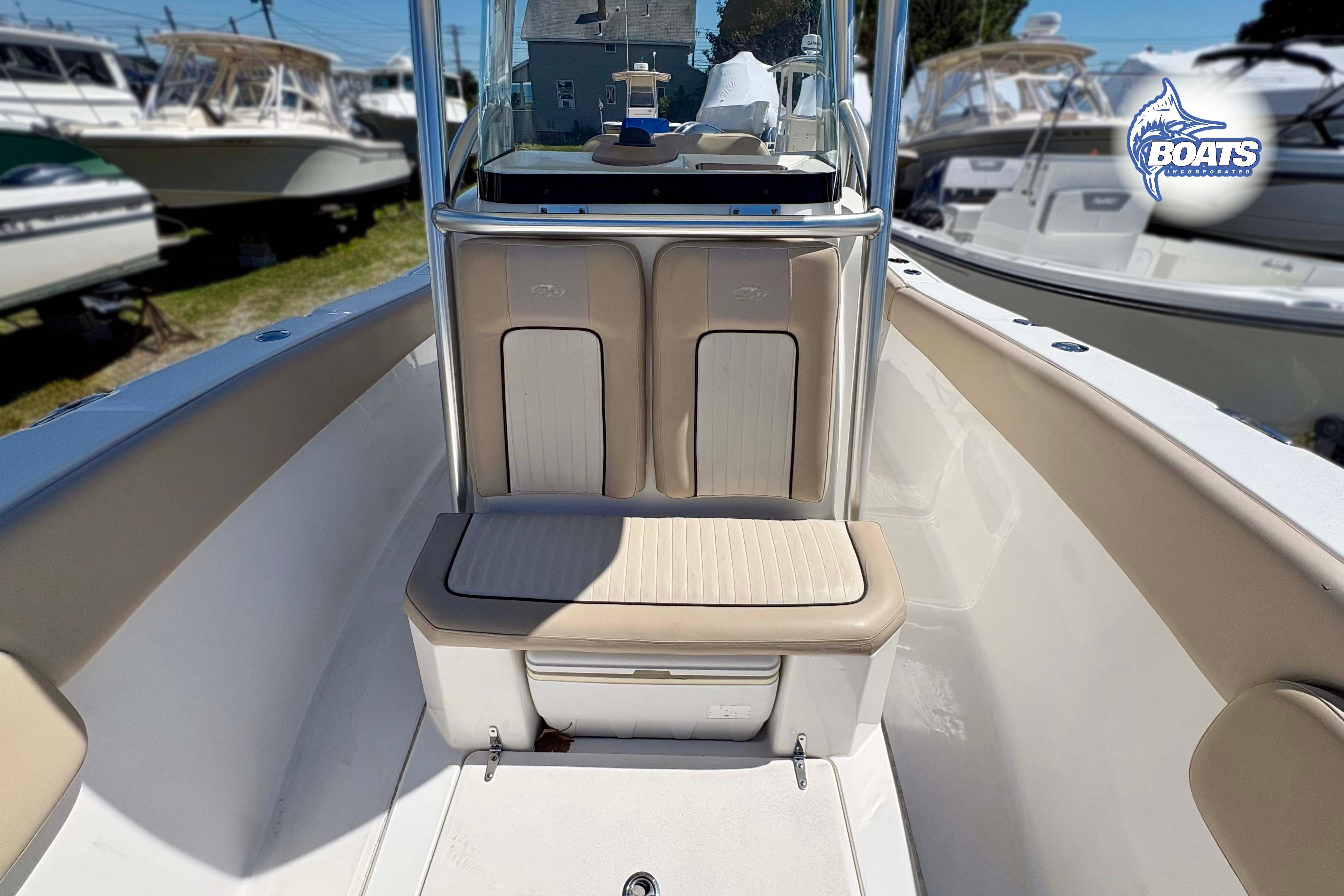 2015 Sea Fox 266 Commander boat interior with cushioned seating and console.