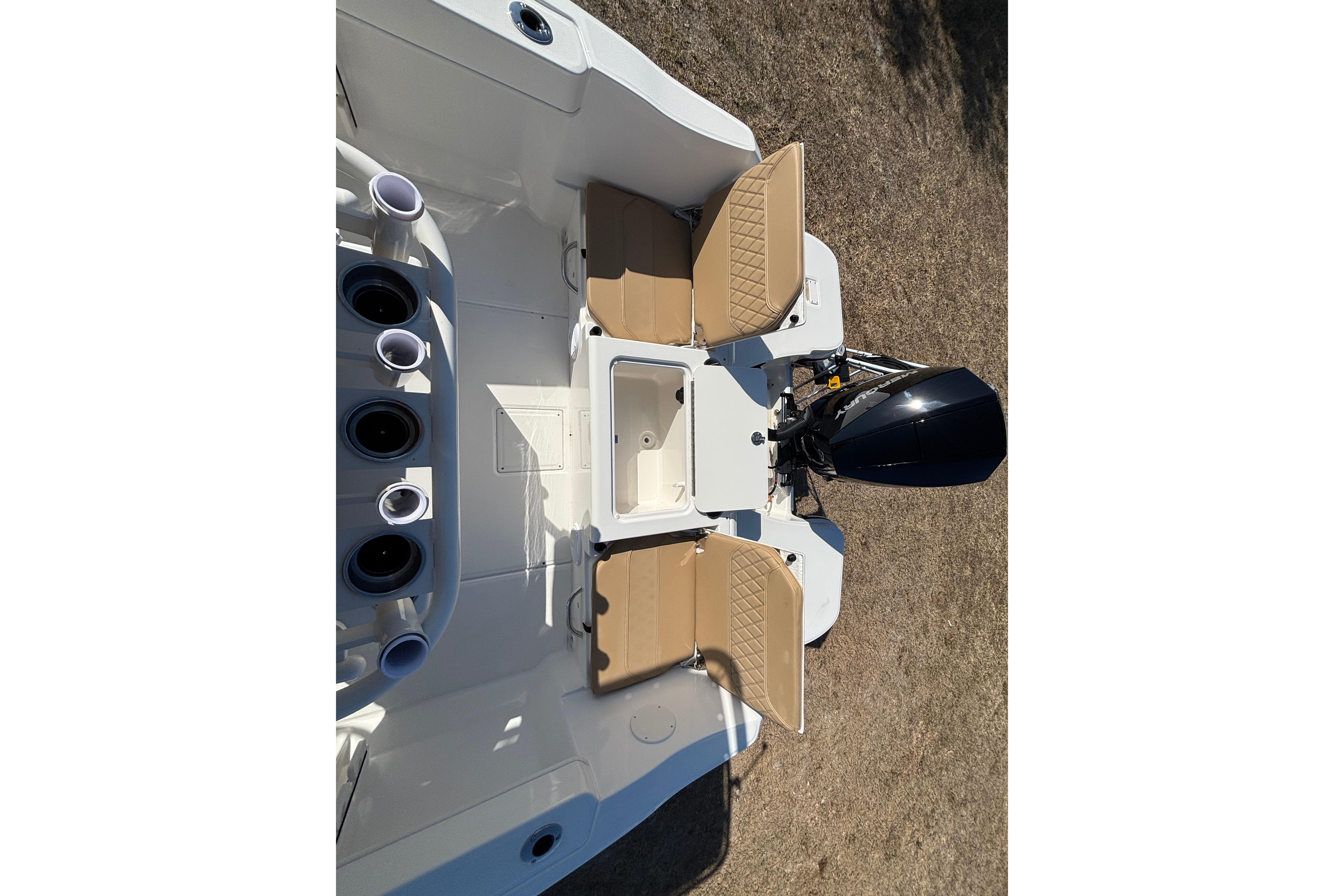 2026 Bayliner Trophy T22CC boat interior with seating and motor, viewed from above.