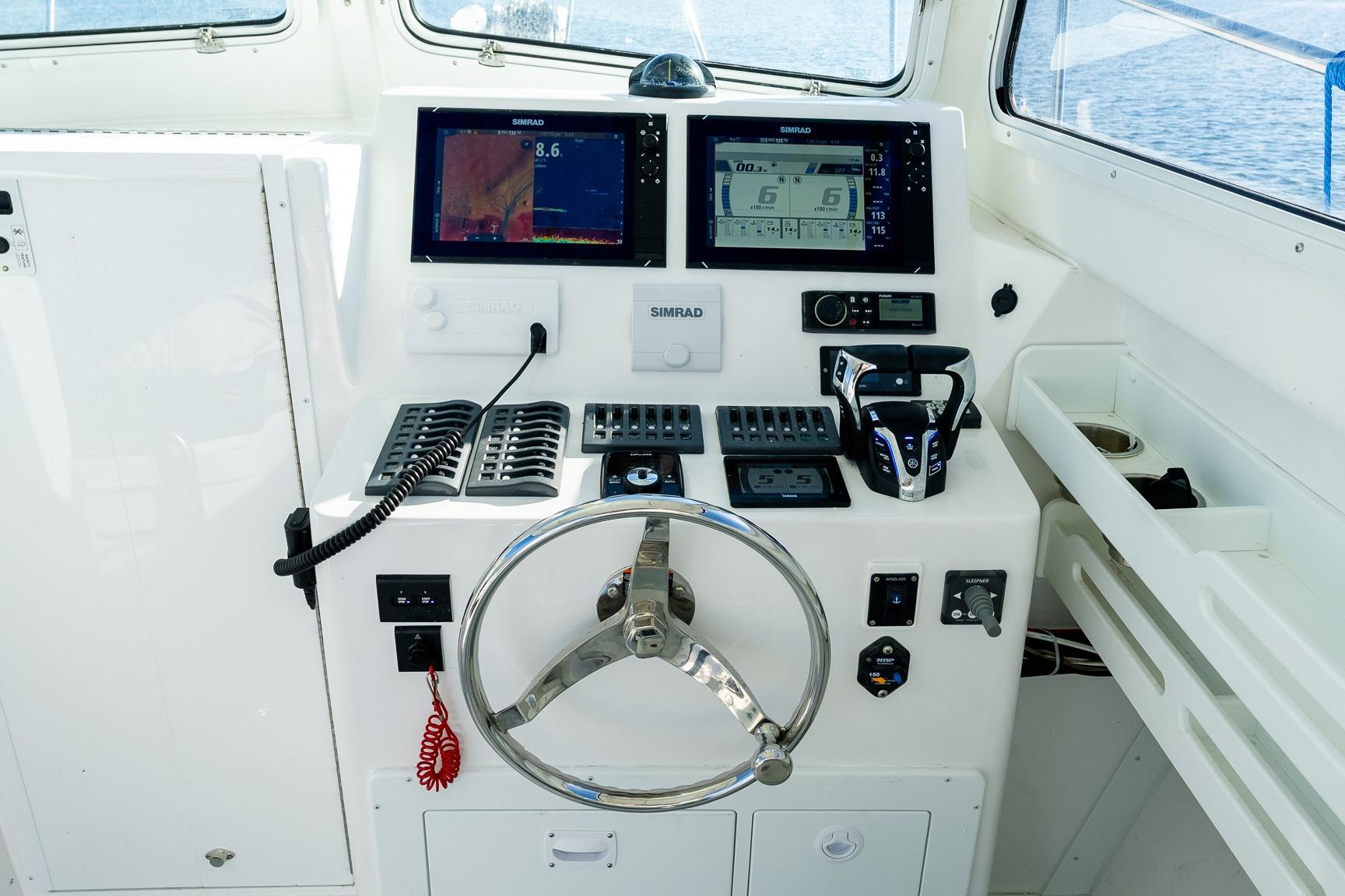 2024 Steiger Craft 31 Fisherman helm with modern navigation and control systems.