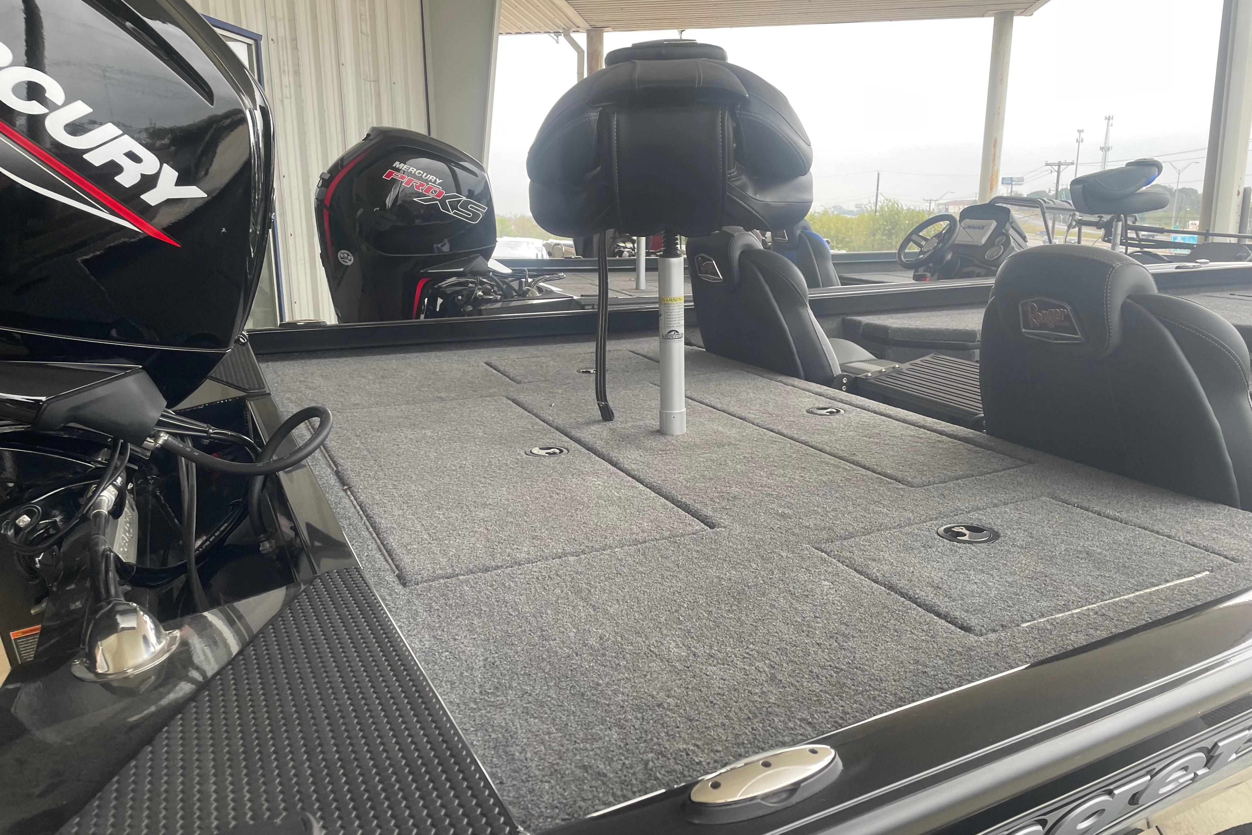 2026 Ranger RT178 boat interior with Mercury engine, featuring spacious seating and storage.