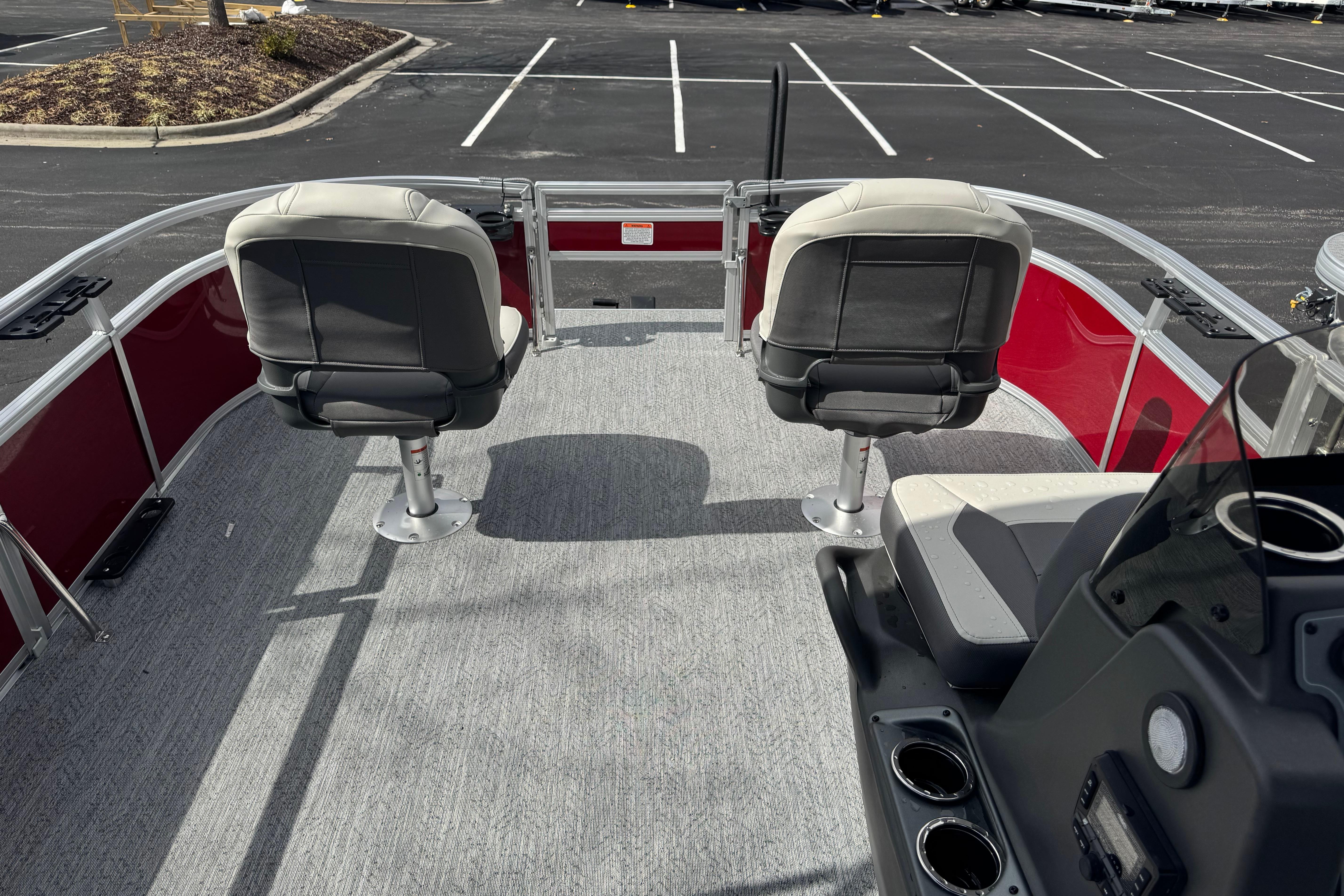 2026 Sun Tracker Bass Buggy 16 XL Select pontoon boat interior with two swivel seats.