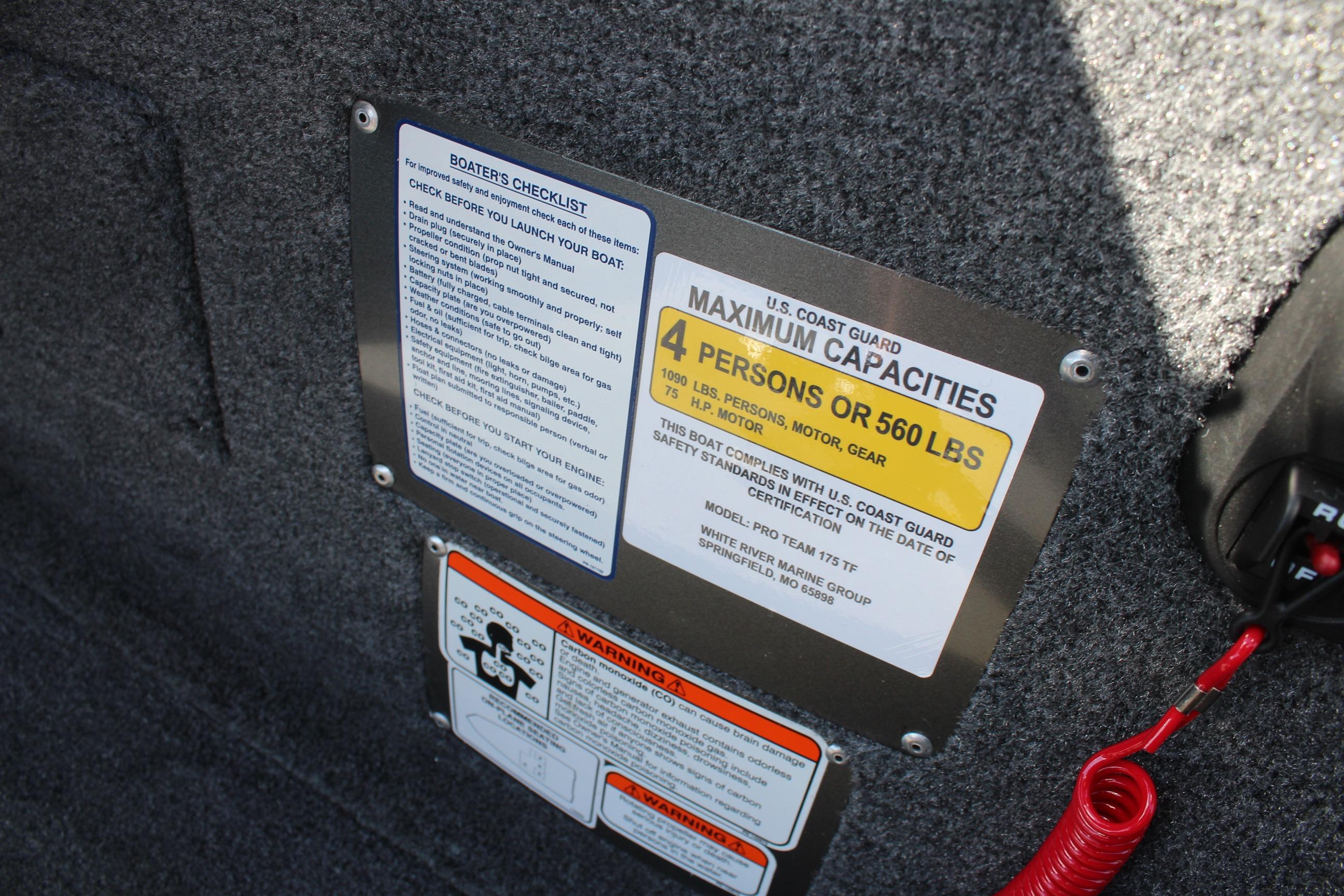 Safety and capacity labels on 2026 Tracker Pro Team 175 Crappie Edition boat interior.