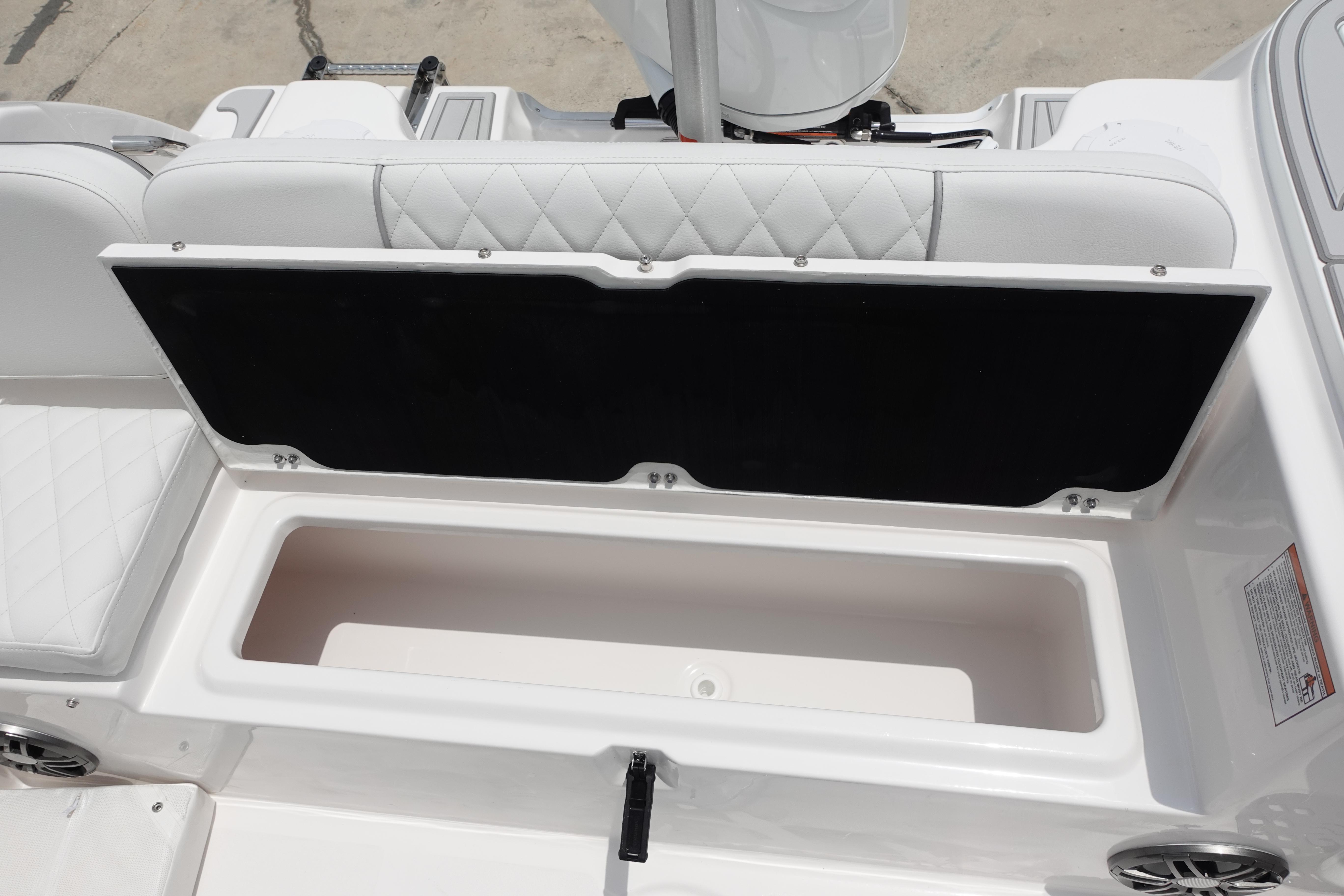 2025 Sea Fox 248 Commander boat storage compartment with open lid, showcasing spacious interior.
