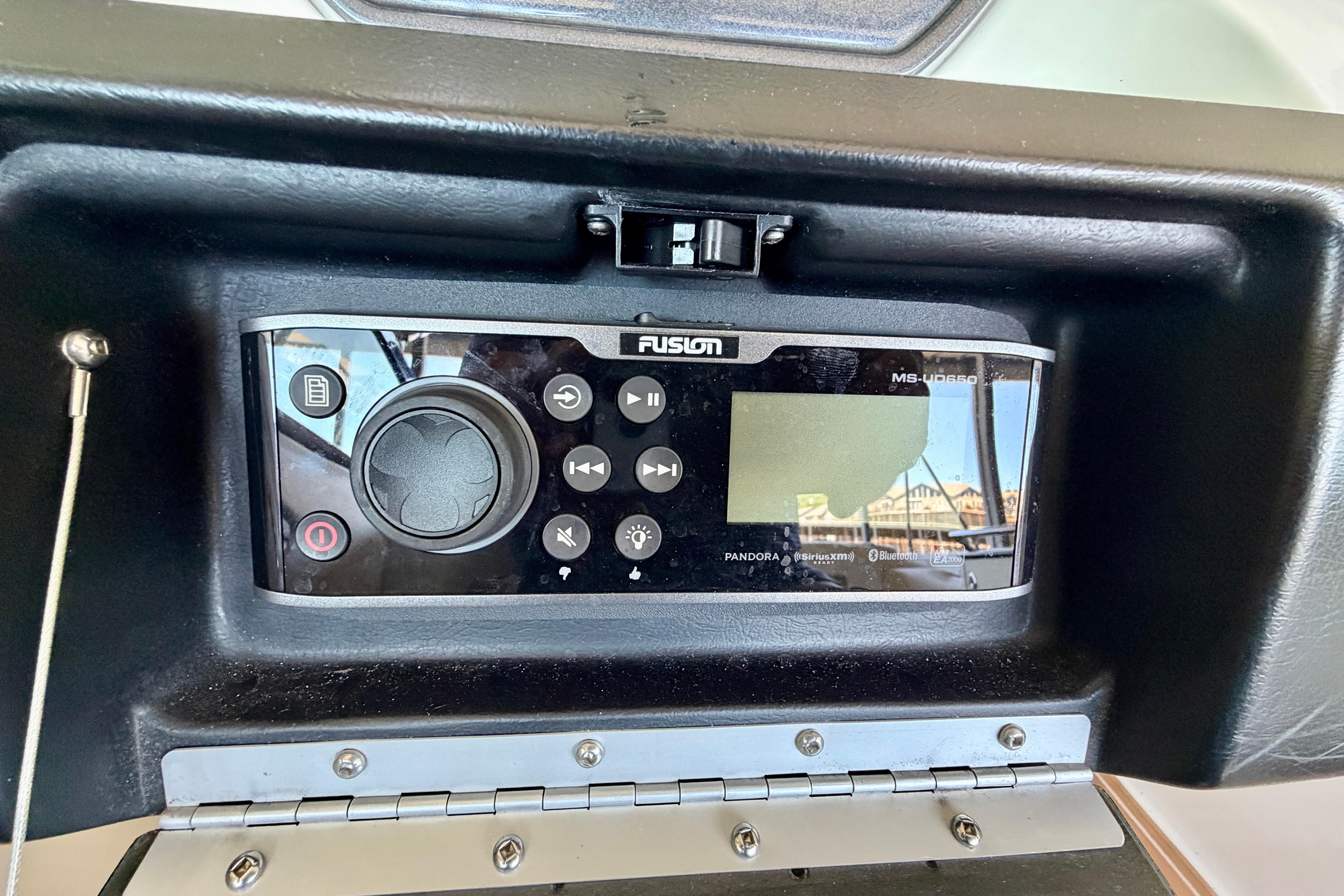 Fusion MS-UD650 stereo system on 2007 Sea Ray 270 SLX boat dashboard.