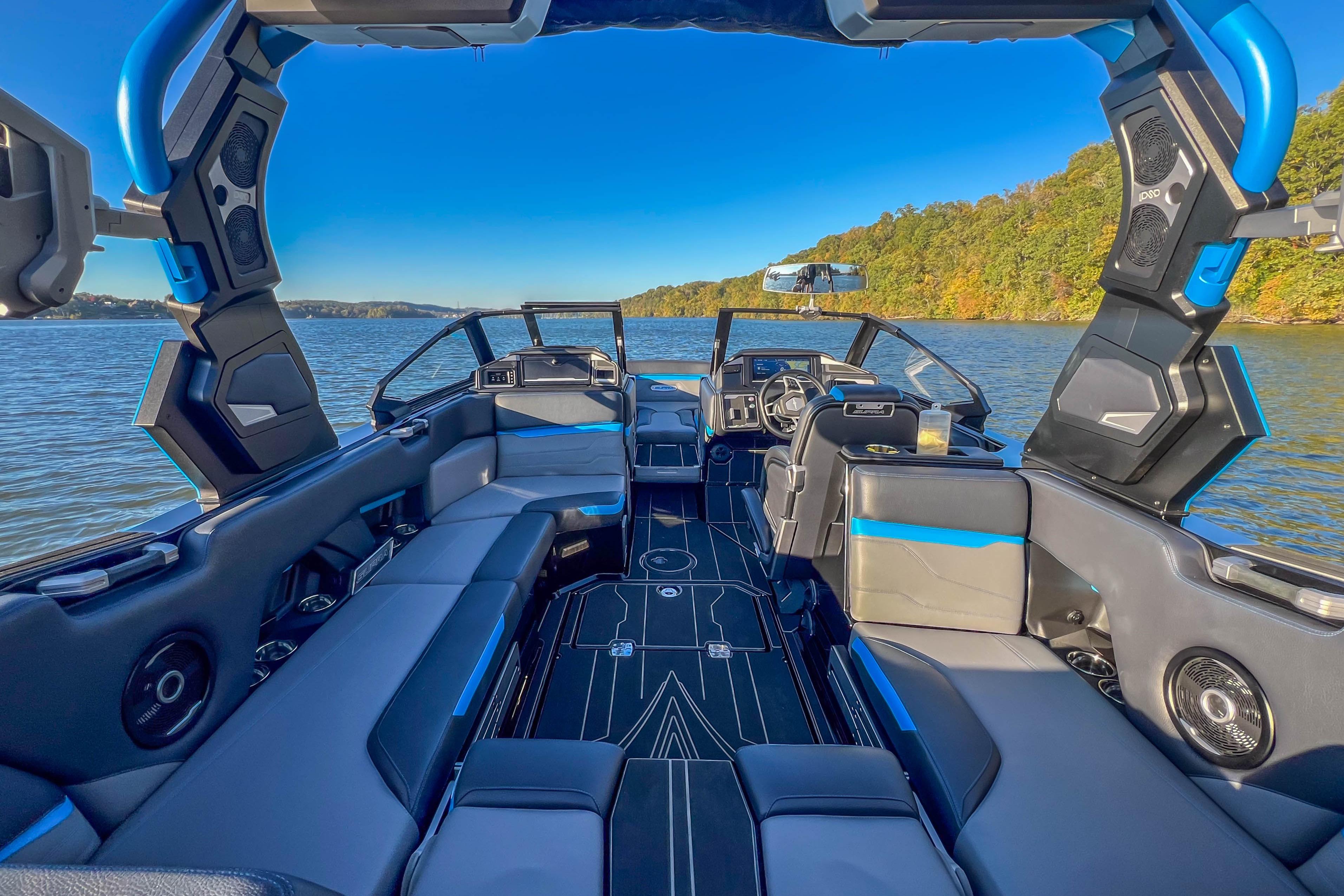 2024 Supra SV 400 boat interior with sleek design on a scenic lake.