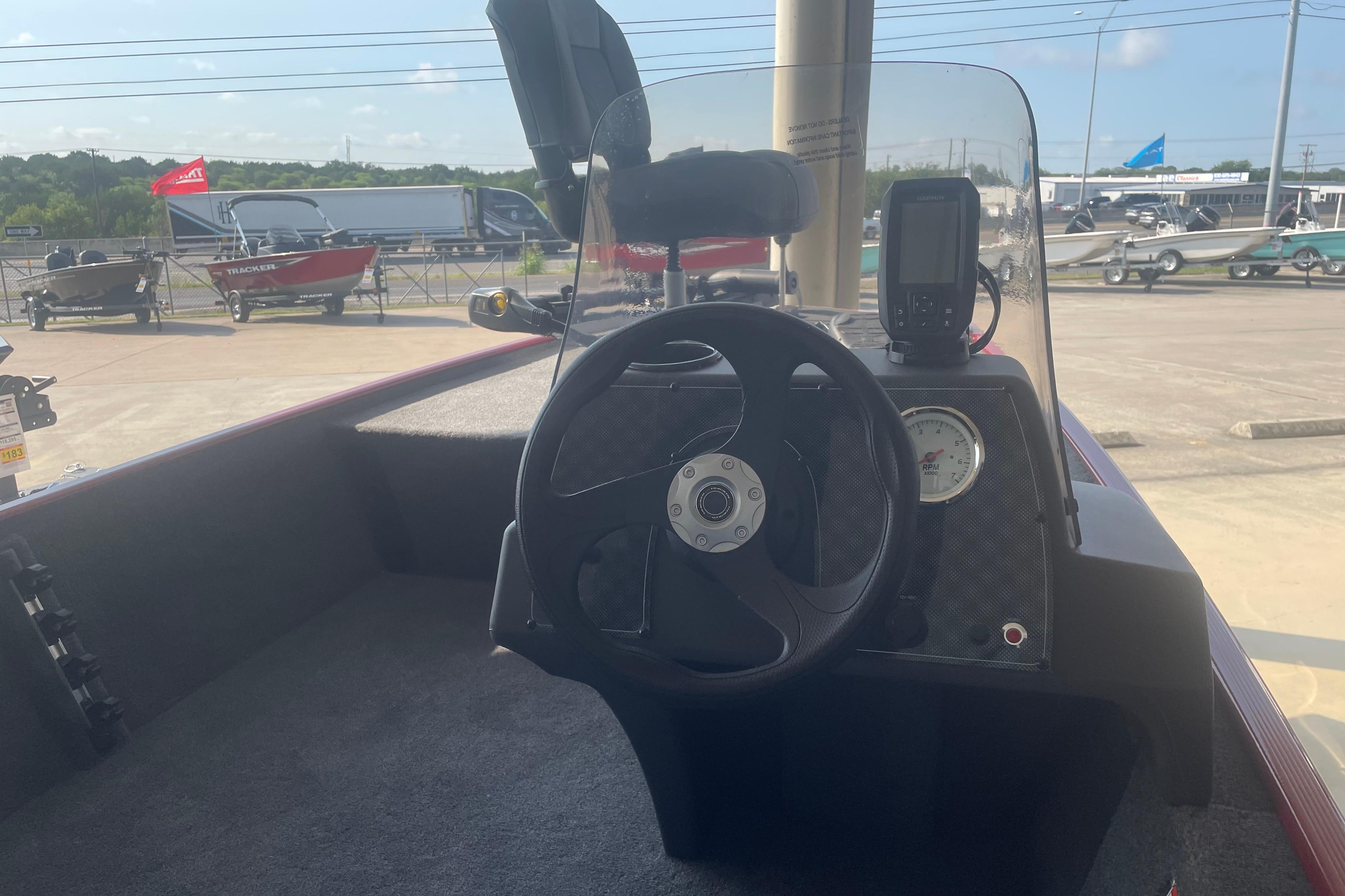 2026 Tracker Bass Tracker Classic XL boat dashboard with steering wheel and gauges.