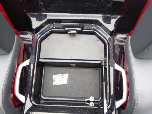 2025 Ranger Z519R Cup-Equipped storage compartment with handles and keys, featuring sleek design.