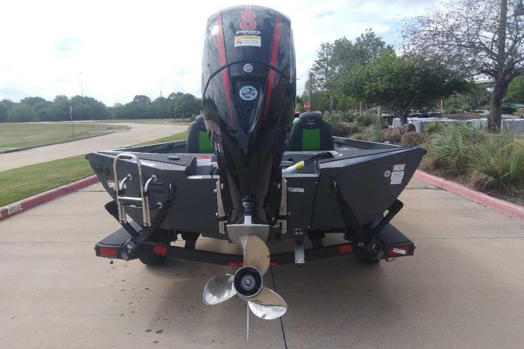 2026 Ranger RT198P boat with powerful outboard motor, parked on a trailer.