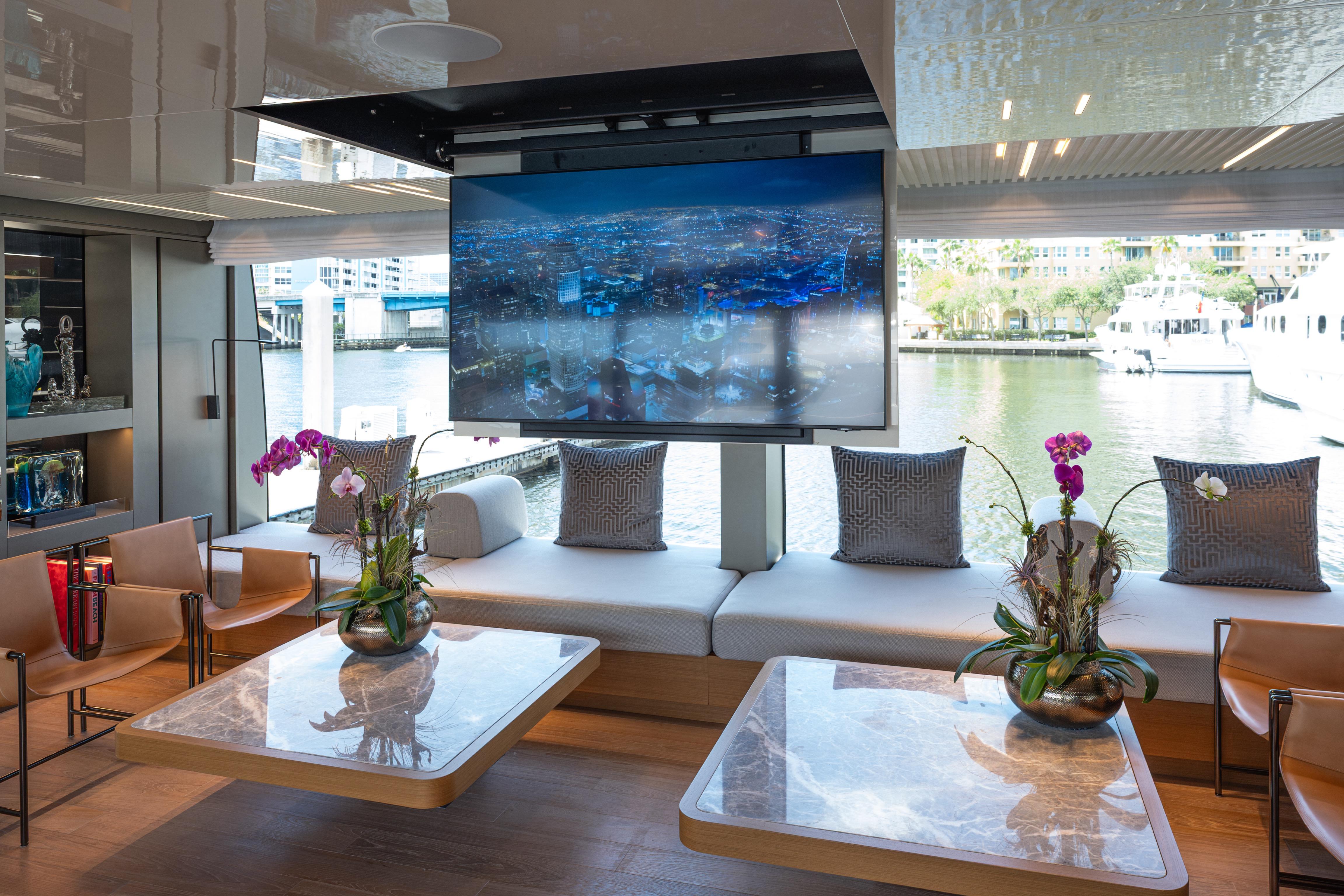Luxurious 2023 Sanlorenzo SL120A yacht interior with modern decor and waterfront view.