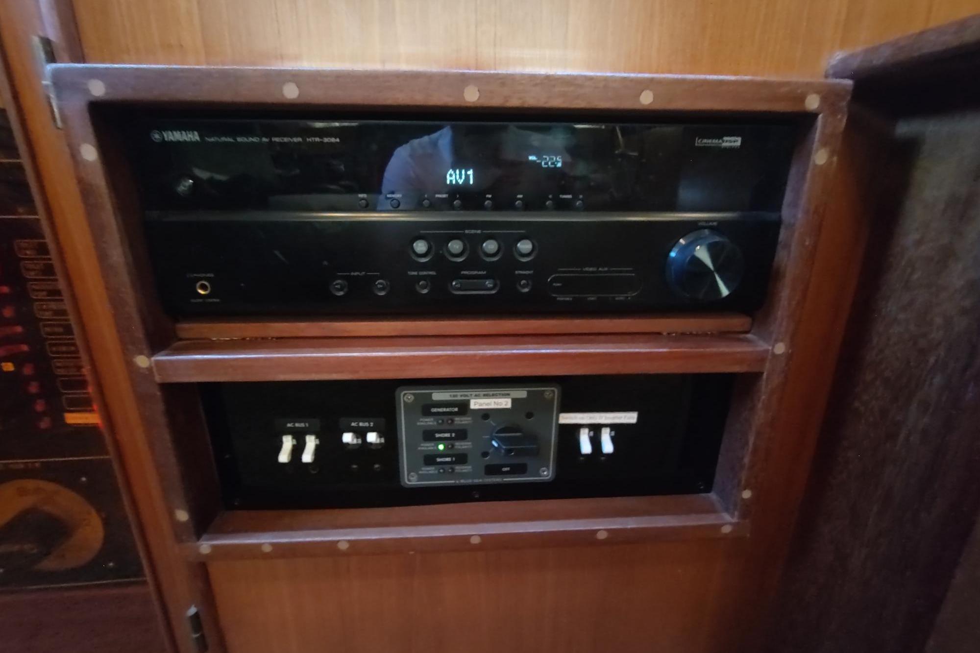 Audio control panel on a 1989 Hyatt Double Cabin Motoryacht, featuring Yamaha receiver.
